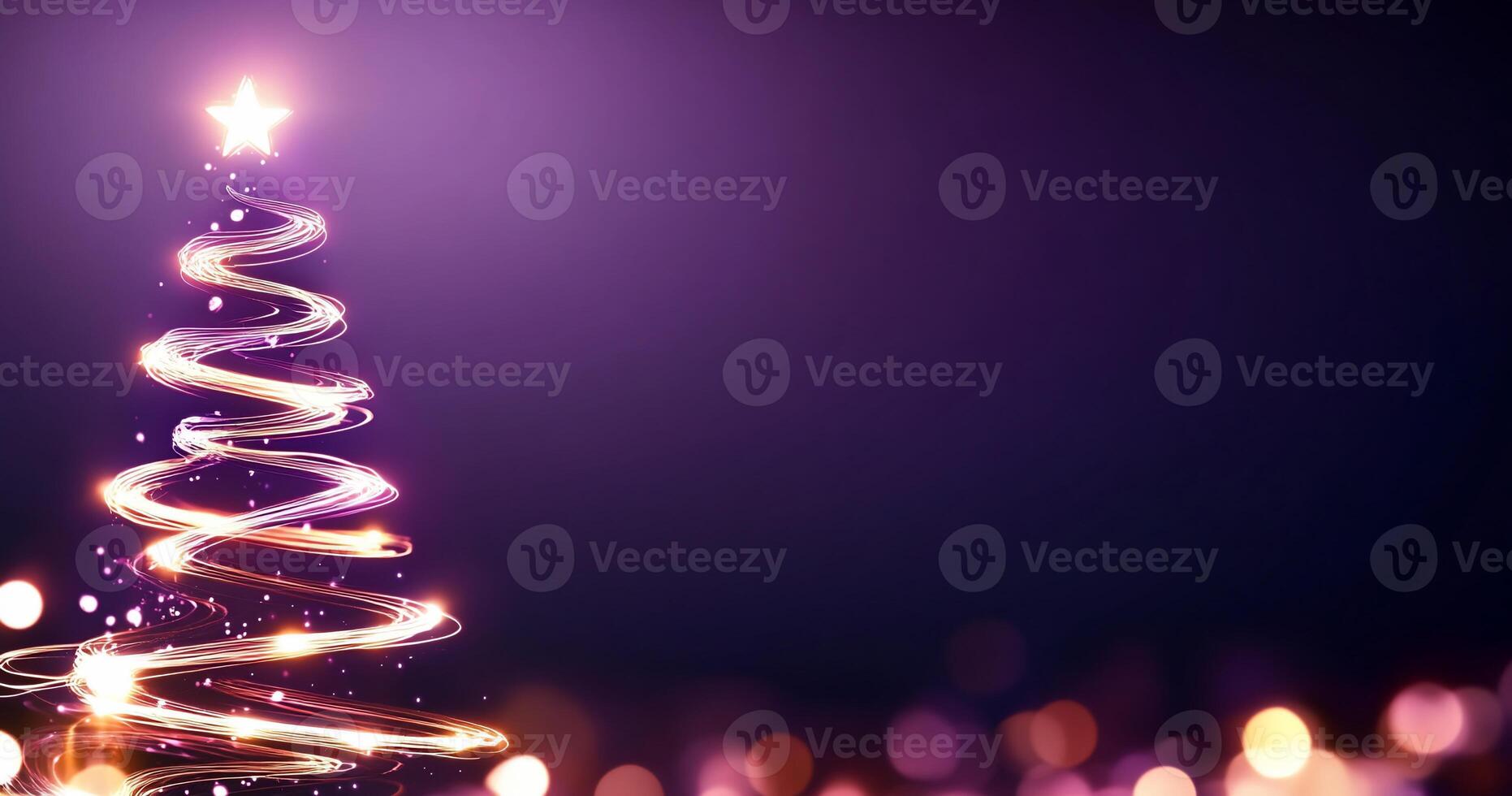 A glowing Christmas tree with a star on top against a purple background. photo