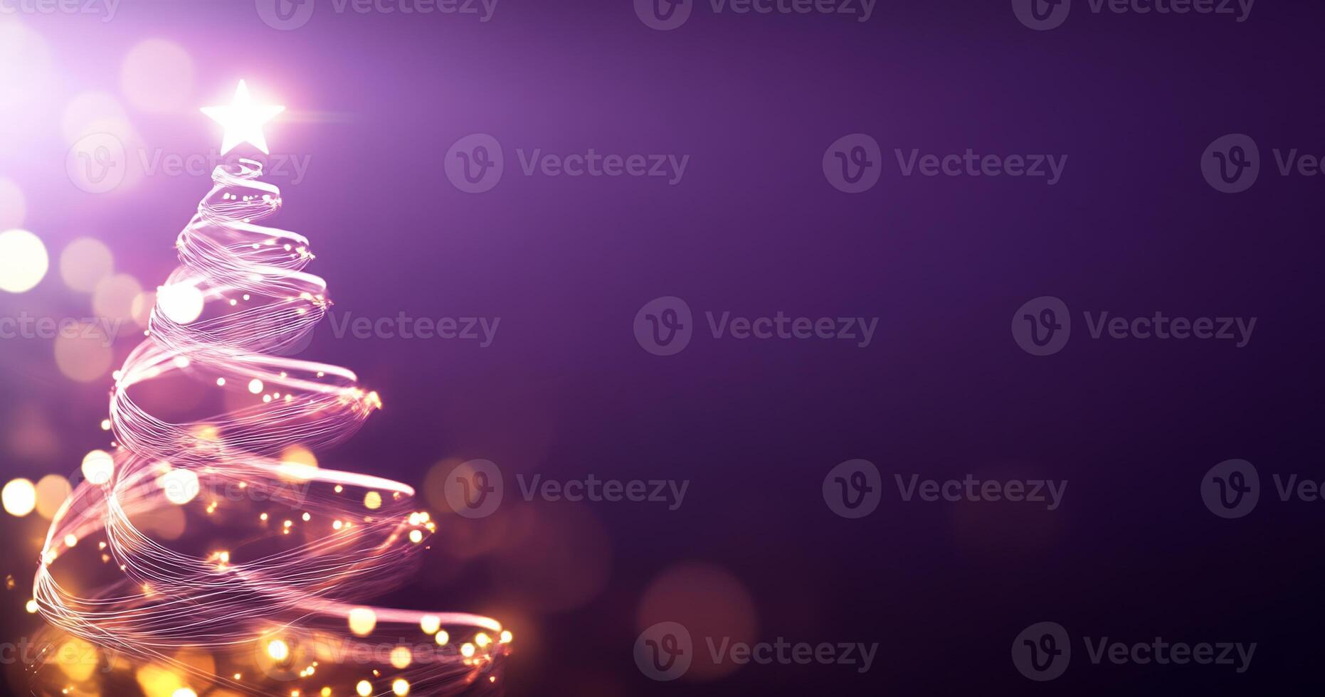 A glowing Christmas tree design with sparkling lights and a star. photo