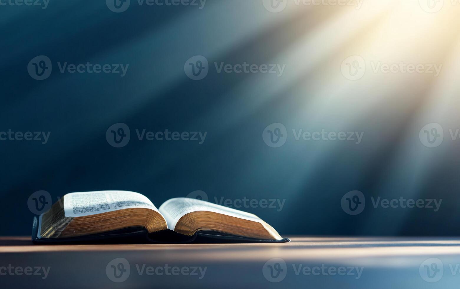 An open book illuminated by soft light, symbolizing knowledge and reflection. photo