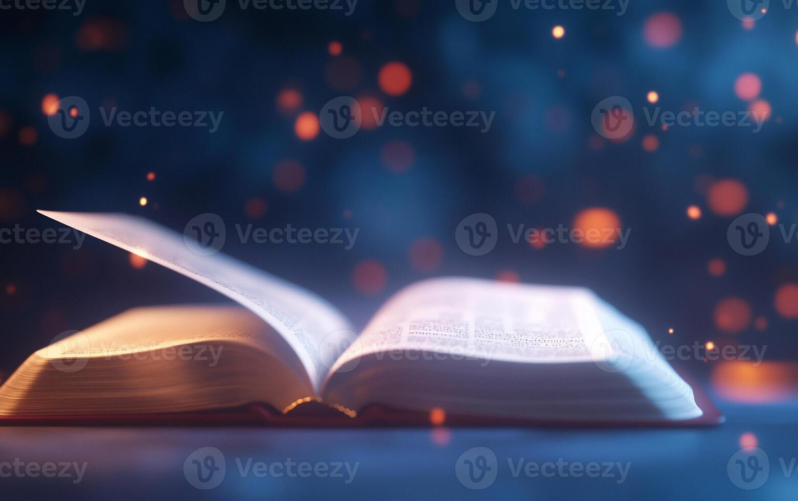 An open book surrounded by a dreamy, illuminated atmosphere. photo