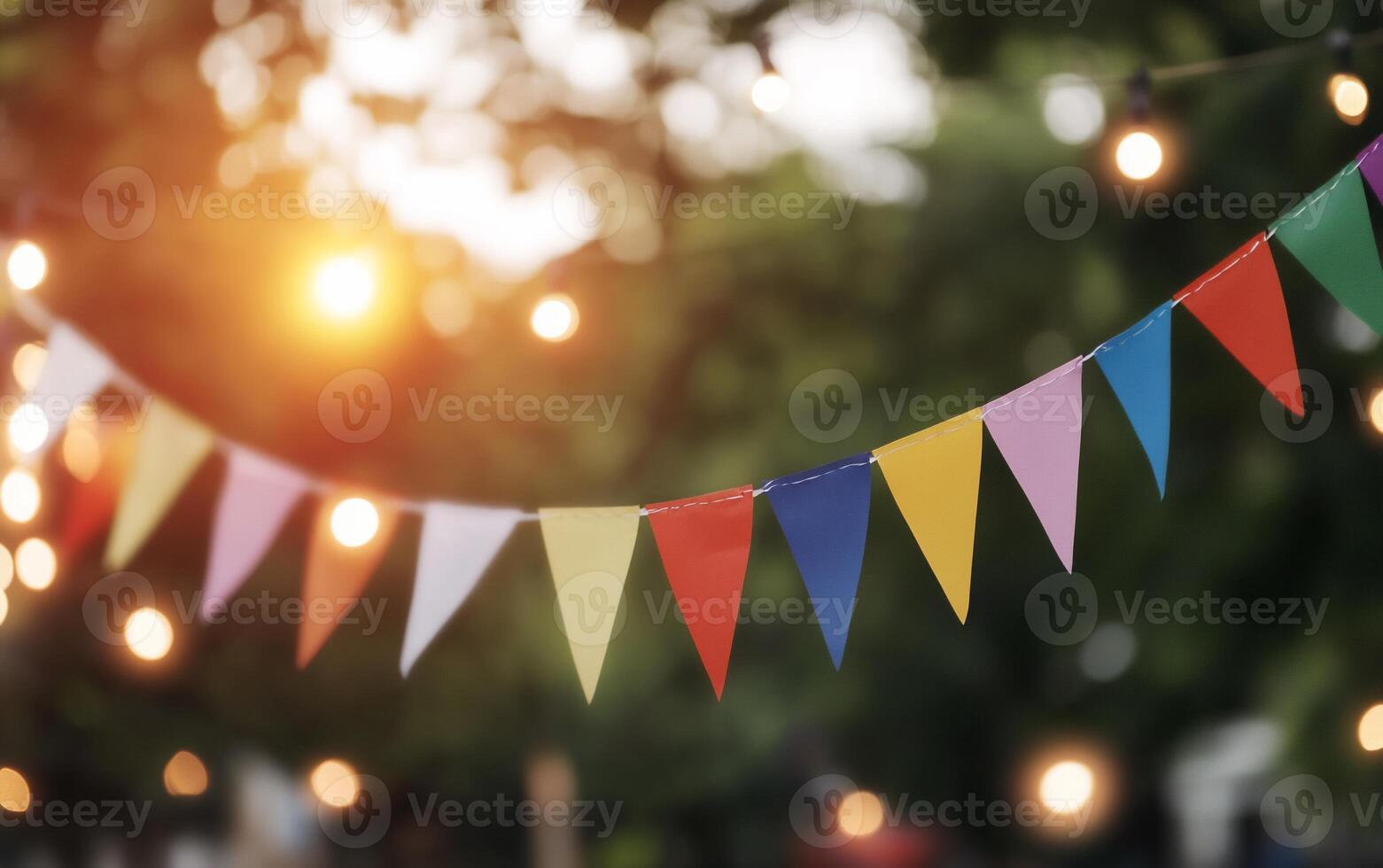 Colorful bunting and warm lights create a festive outdoor atmosphere. photo