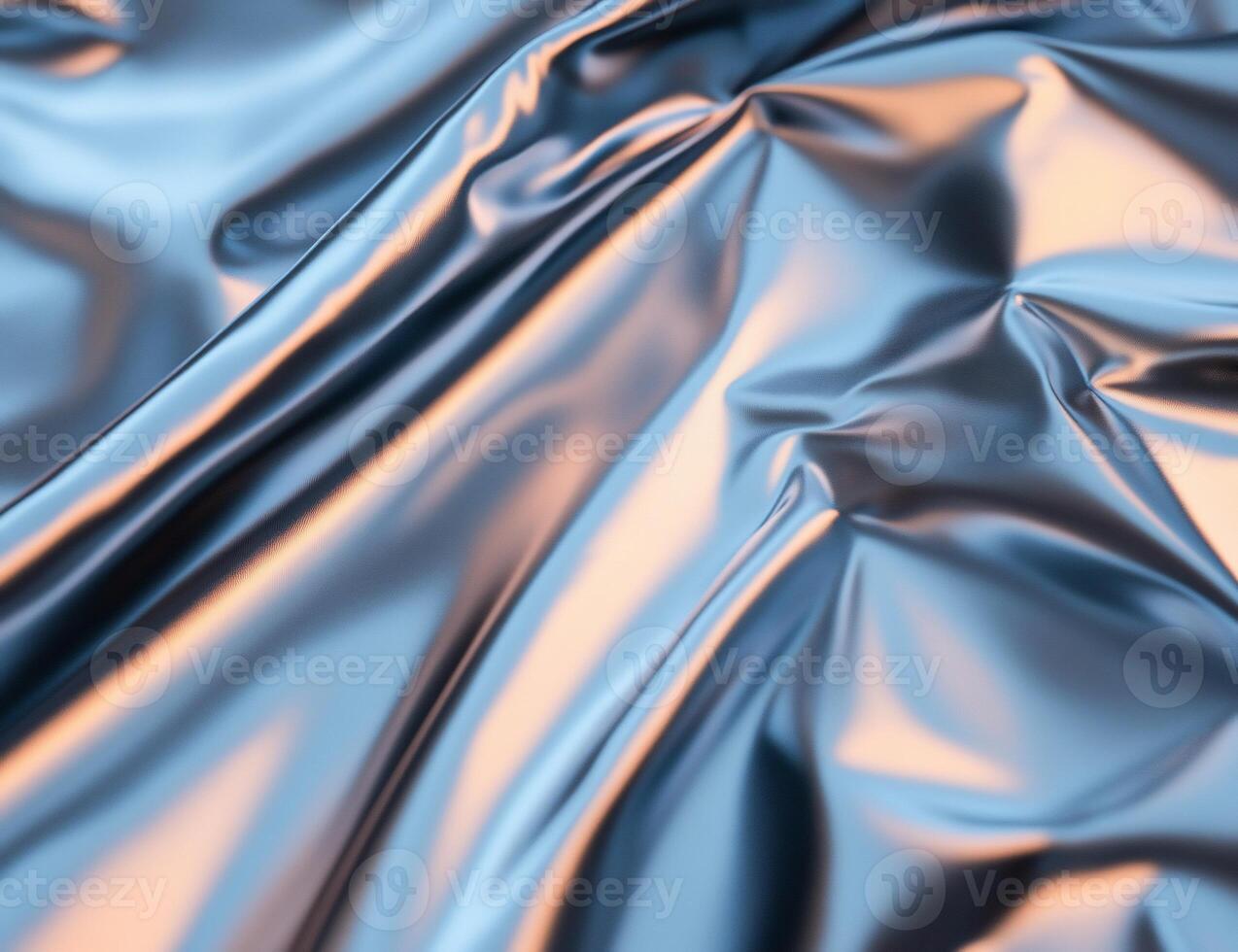 A close-up of shiny, crumpled blue fabric with reflective surfaces. photo