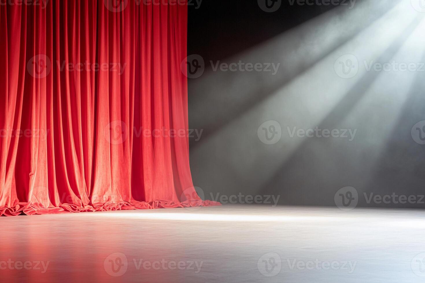 A stage with red curtains and a spotlight, ready for a performance. photo
