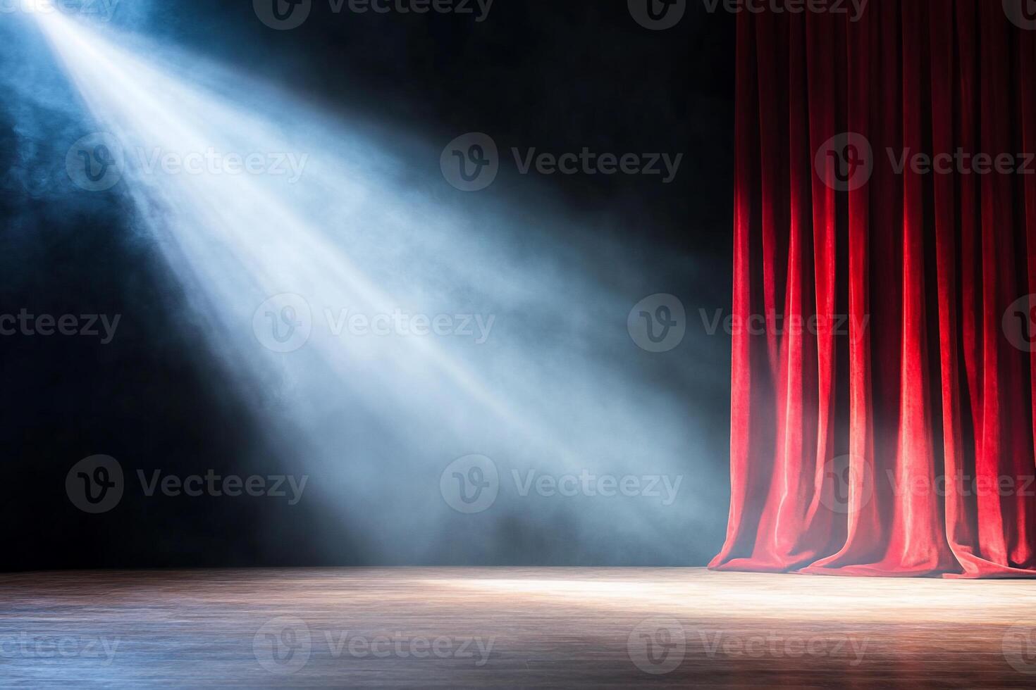 A dramatic stage with red curtains and a spotlight illuminating the floor. photo