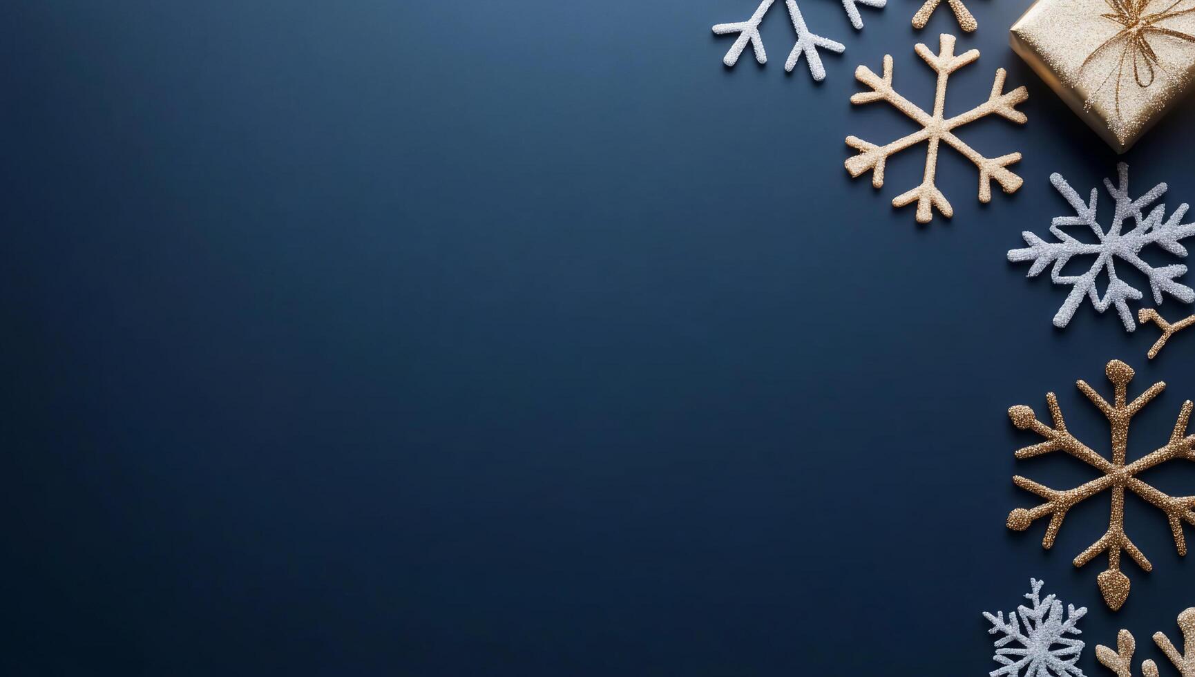 A festive arrangement with snowflakes and a gift on a dark background. photo