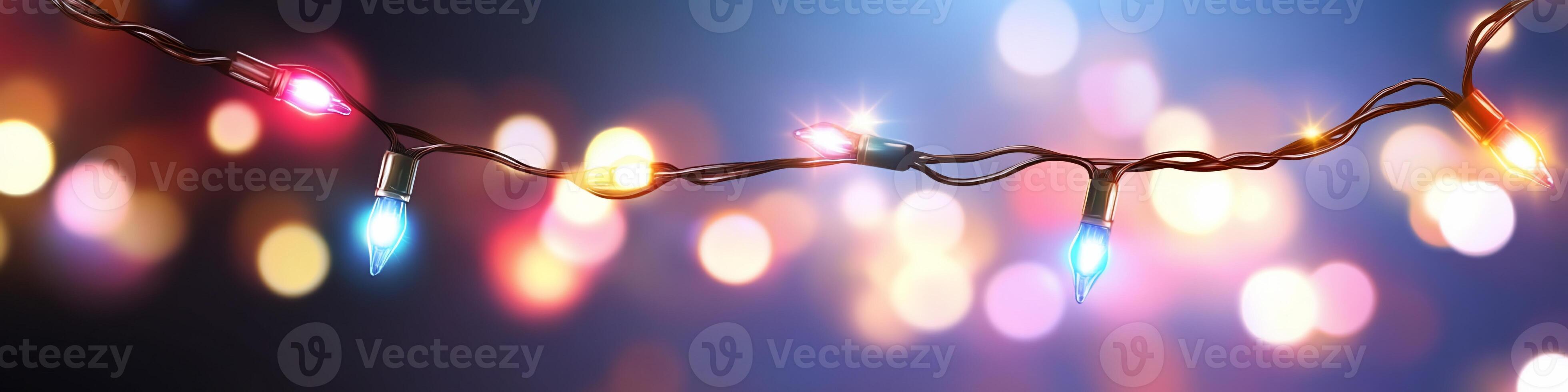 Christmas lights on a wire with bokeh lights photo