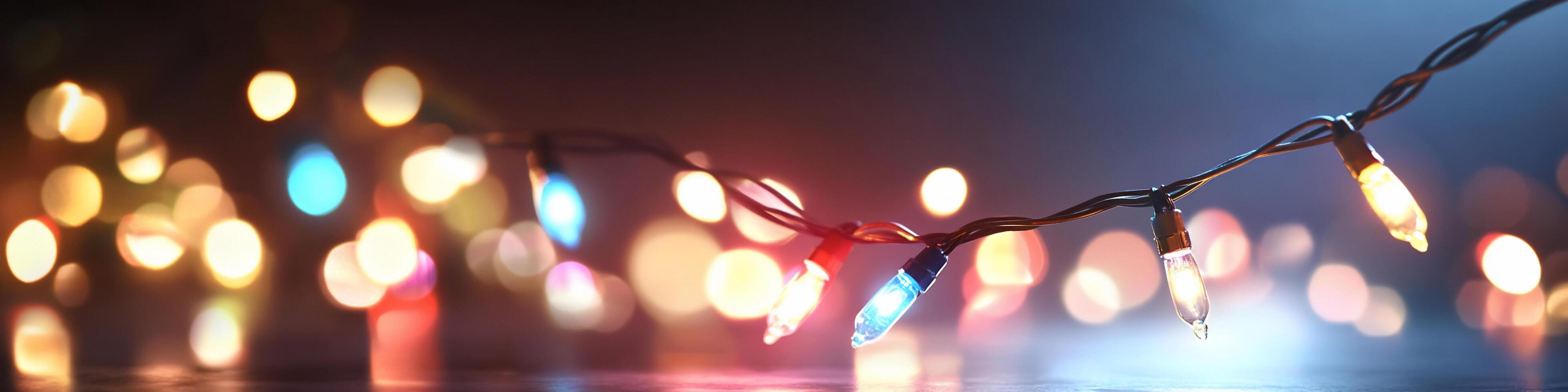 Colorful string lights against a blurred background create a festive ambiance. photo