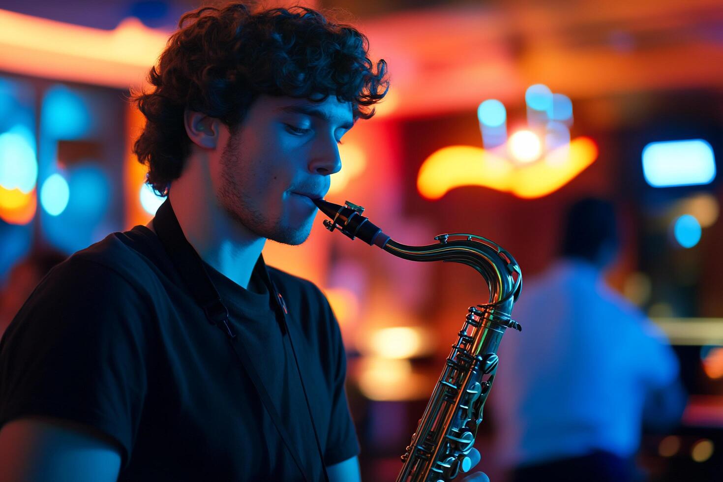 A young man plays the saxophone in a vibrant, colorful setting. photo