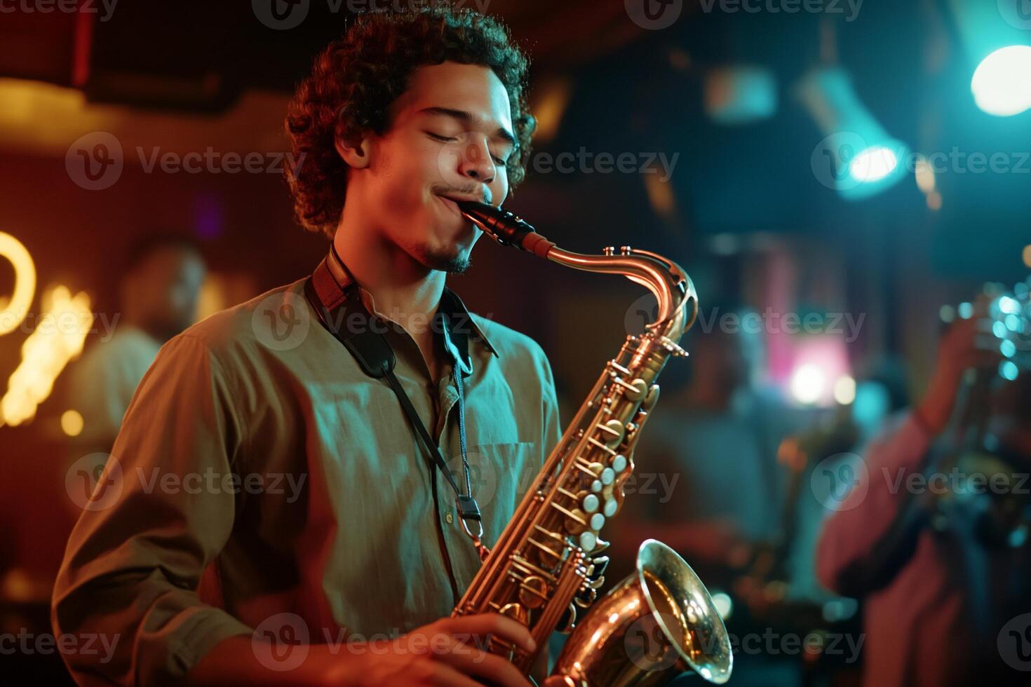 A man playing the saxophone in a bar photo