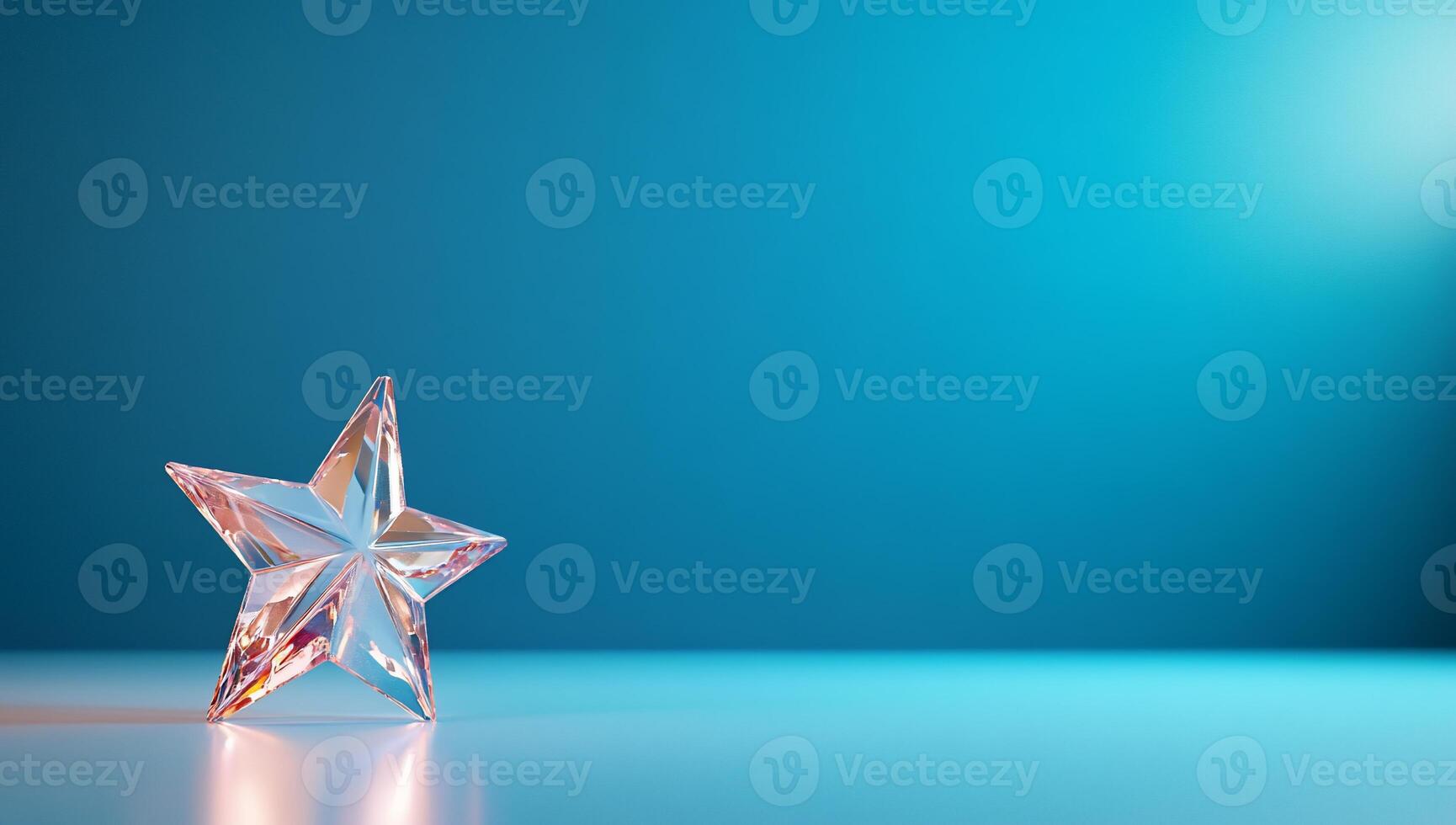 A clear crystal star on a smooth surface against a blue background. photo