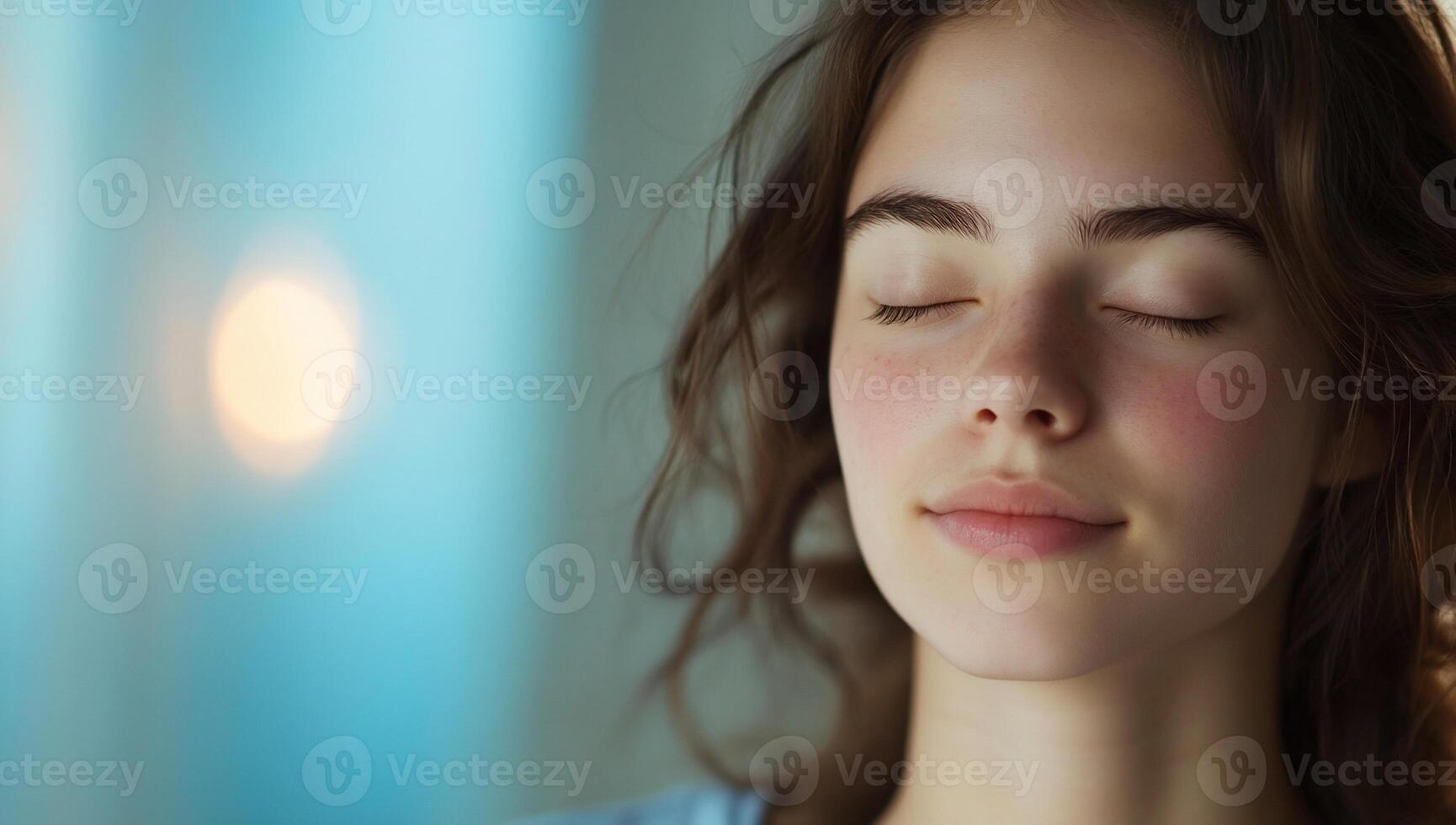 A woman with her eyes closed and her eyes closed photo