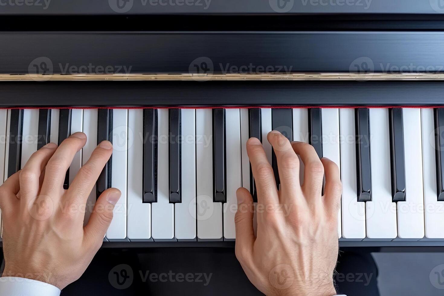 A person's hands playing a piano, showcasing musical talent and creativity. photo