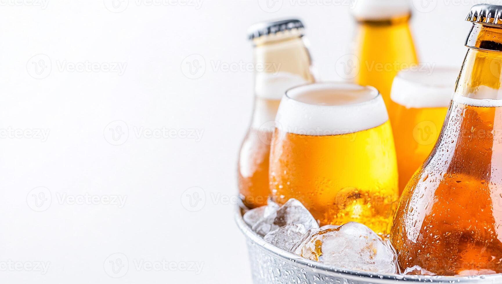Beer bottles in a bucket with ice photo