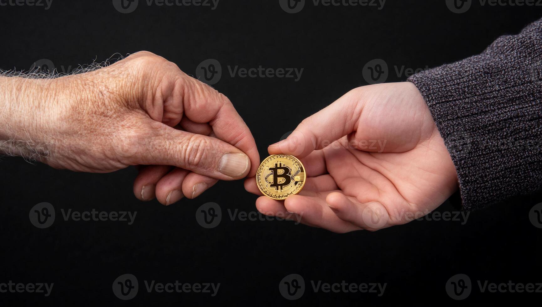Bitcoin and old man's hand photo