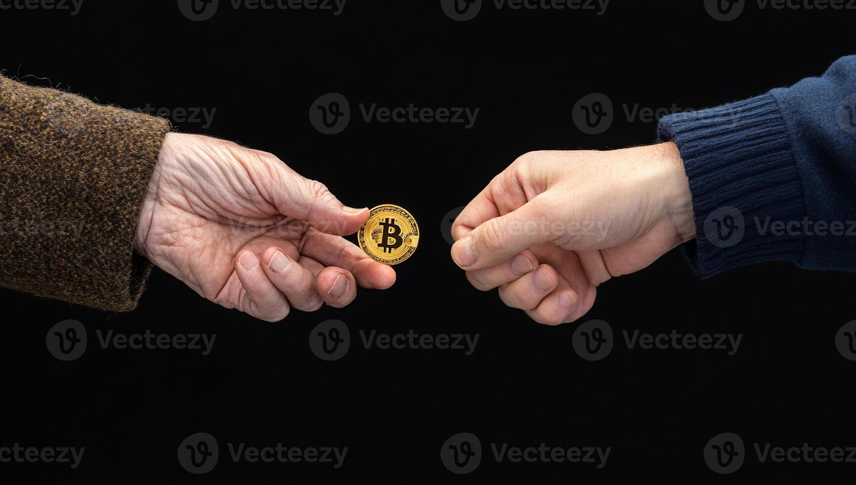Bitcoin and old man's hand on black background photo
