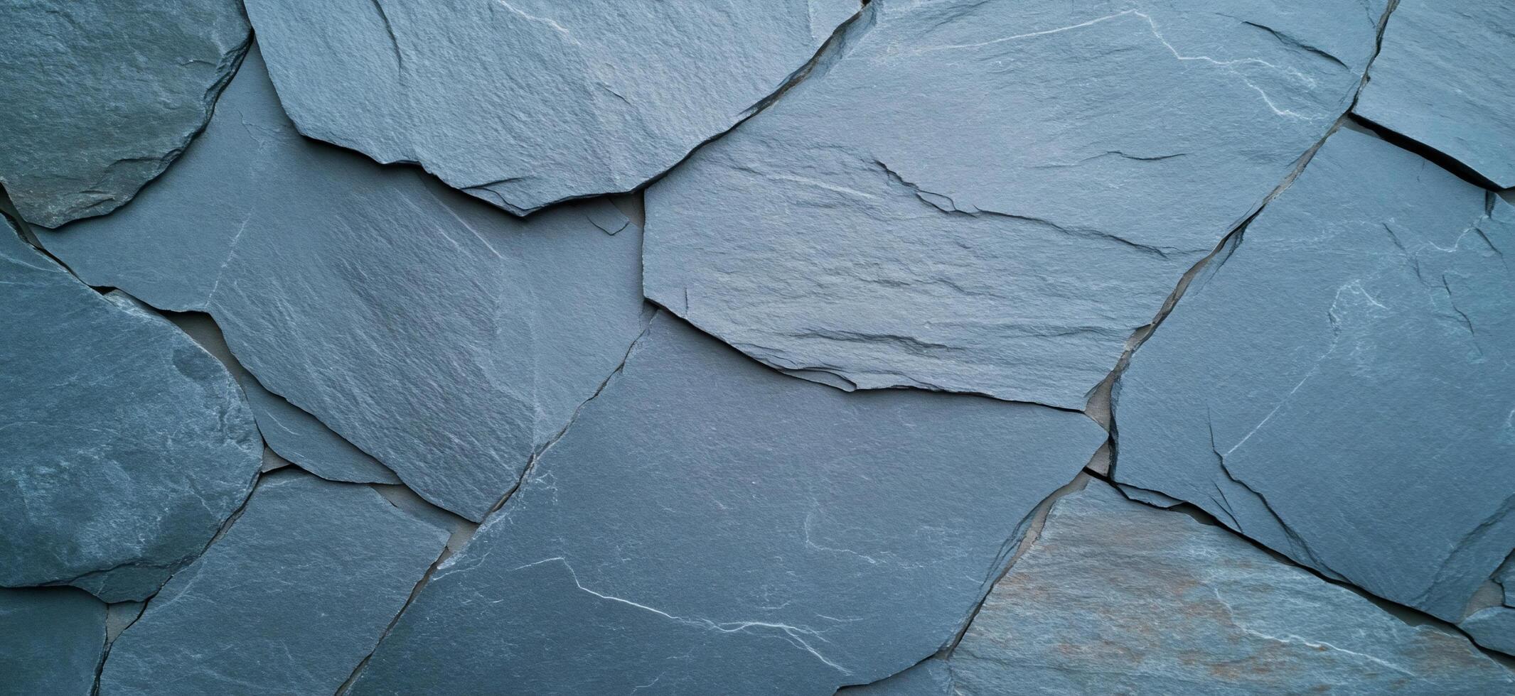 A close-up view of textured slate stone tiles arranged in a pattern. photo