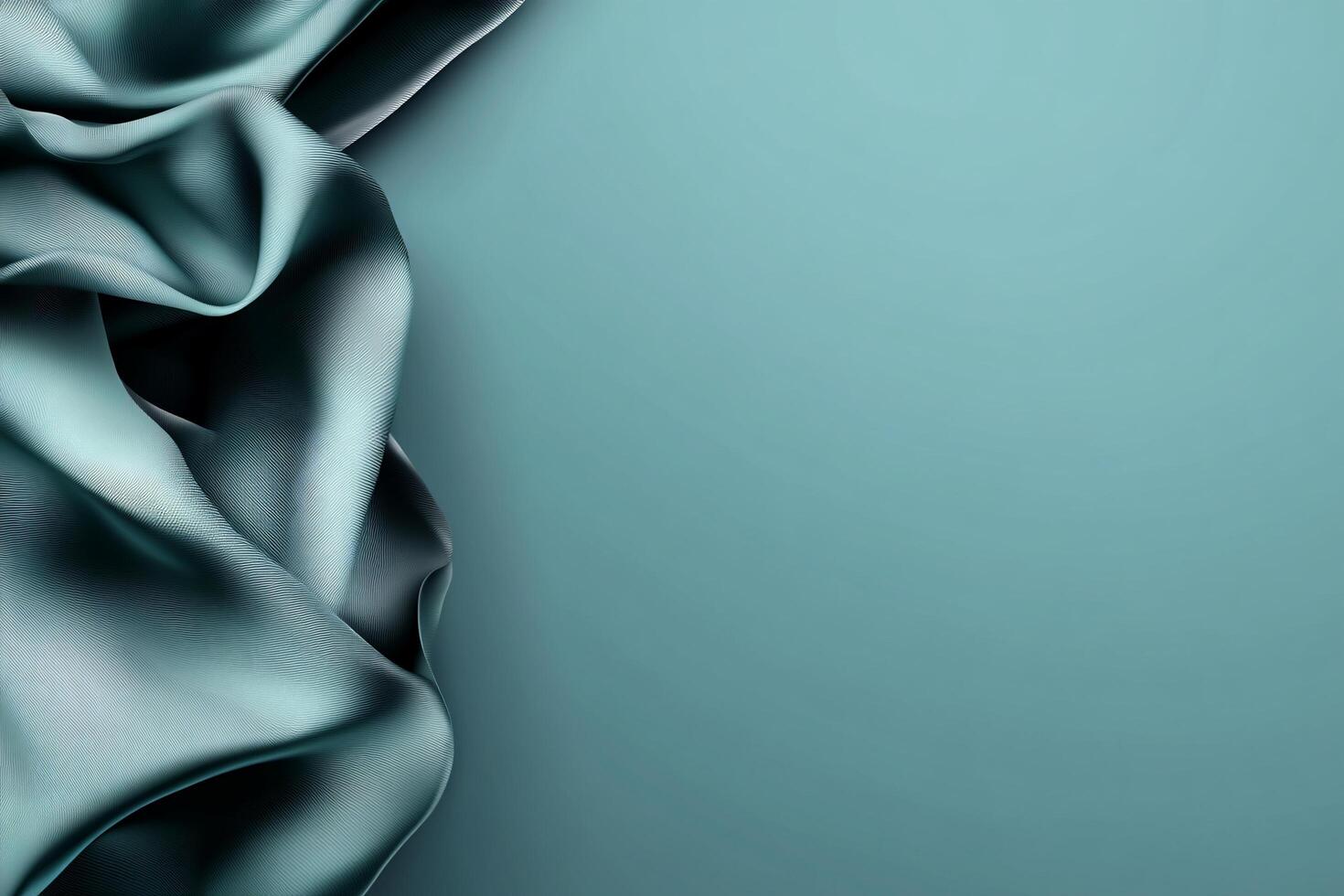 A smooth, draped fabric against a soft teal background. photo