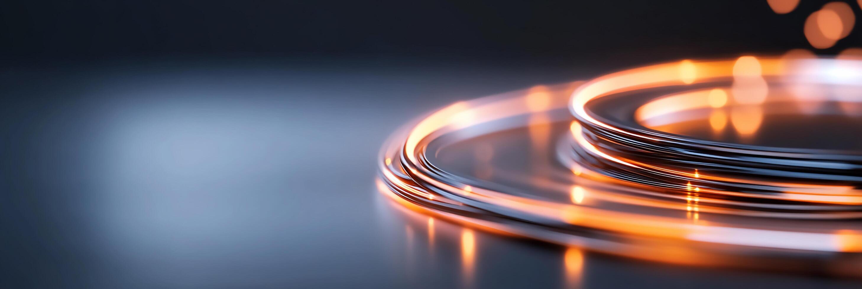 Close-up of glowing metal wires on a reflective surface. photo