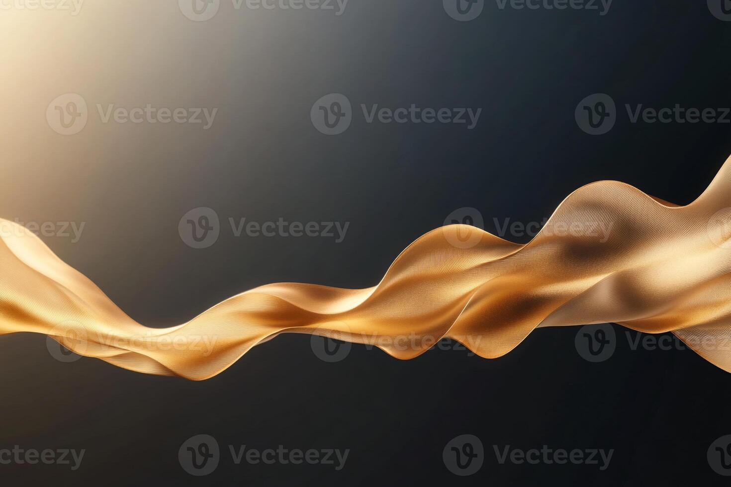 A flowing ribbon of golden fabric against a dark background. photo