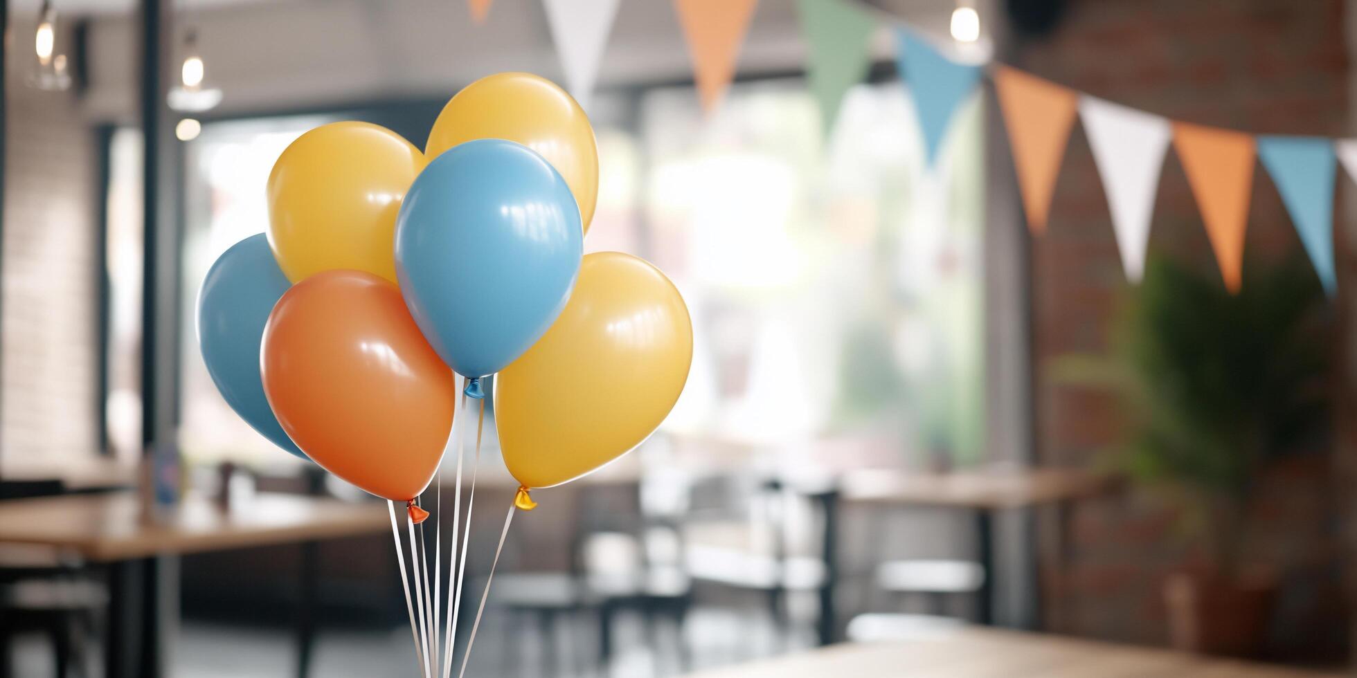 A bunch of balloons sitting on a table in front of a room photo