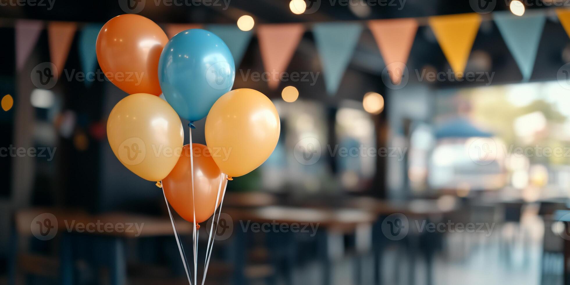 Colorful balloons in a festive setting with bunting decorations. photo