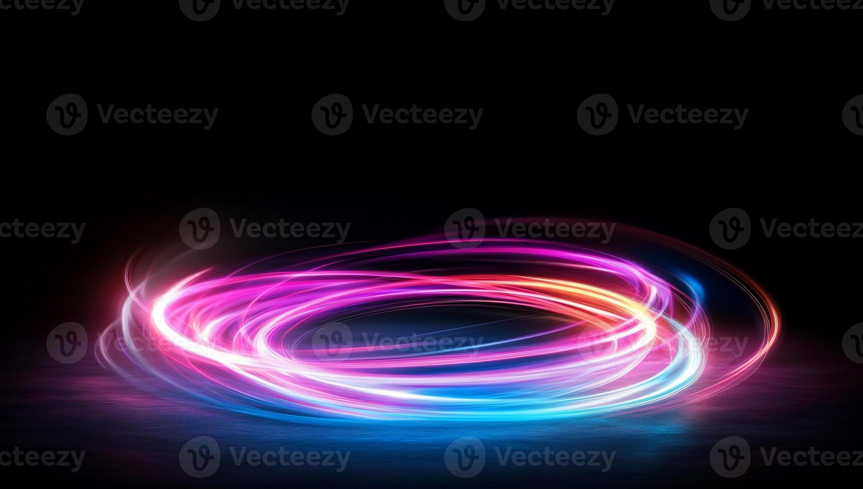 Abstract swirl of colorful light against a dark background. photo