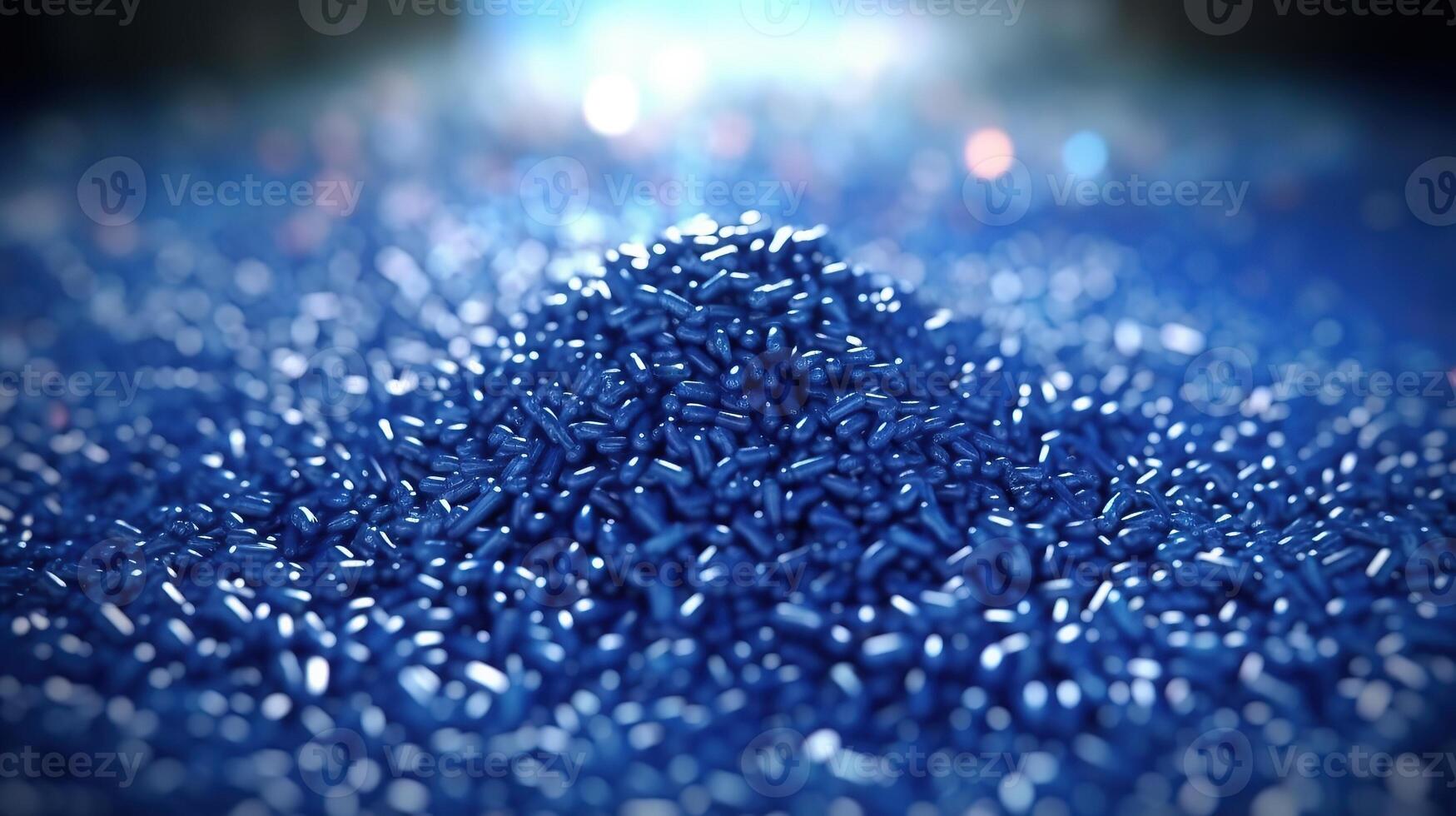 A pile of blue beads on a dark surface photo