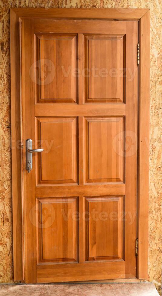 Closed wooden door without people photo