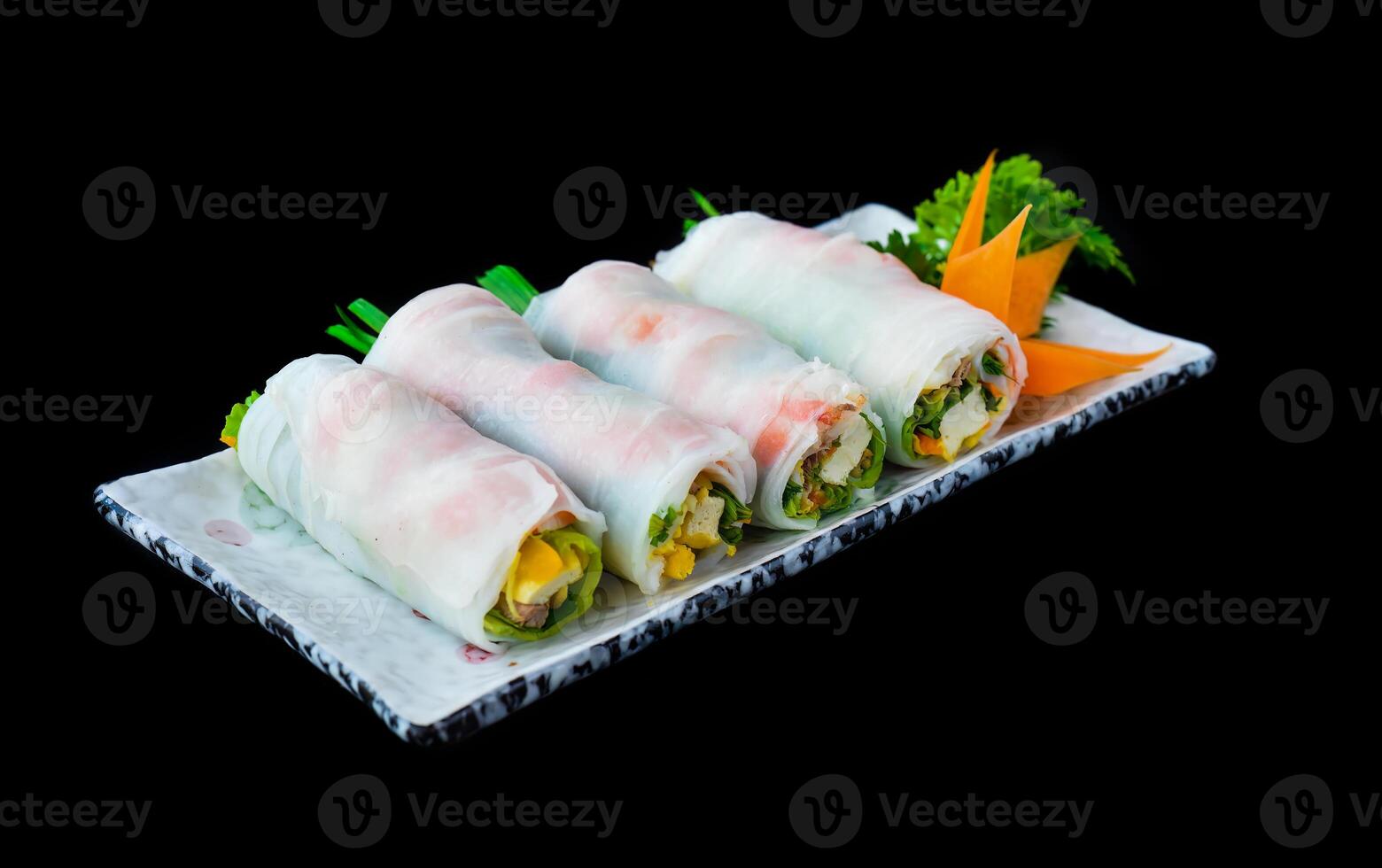 Vietnamese Pho spring rolls with sea food, tofu, vegetables isolated on black background for a menu photo