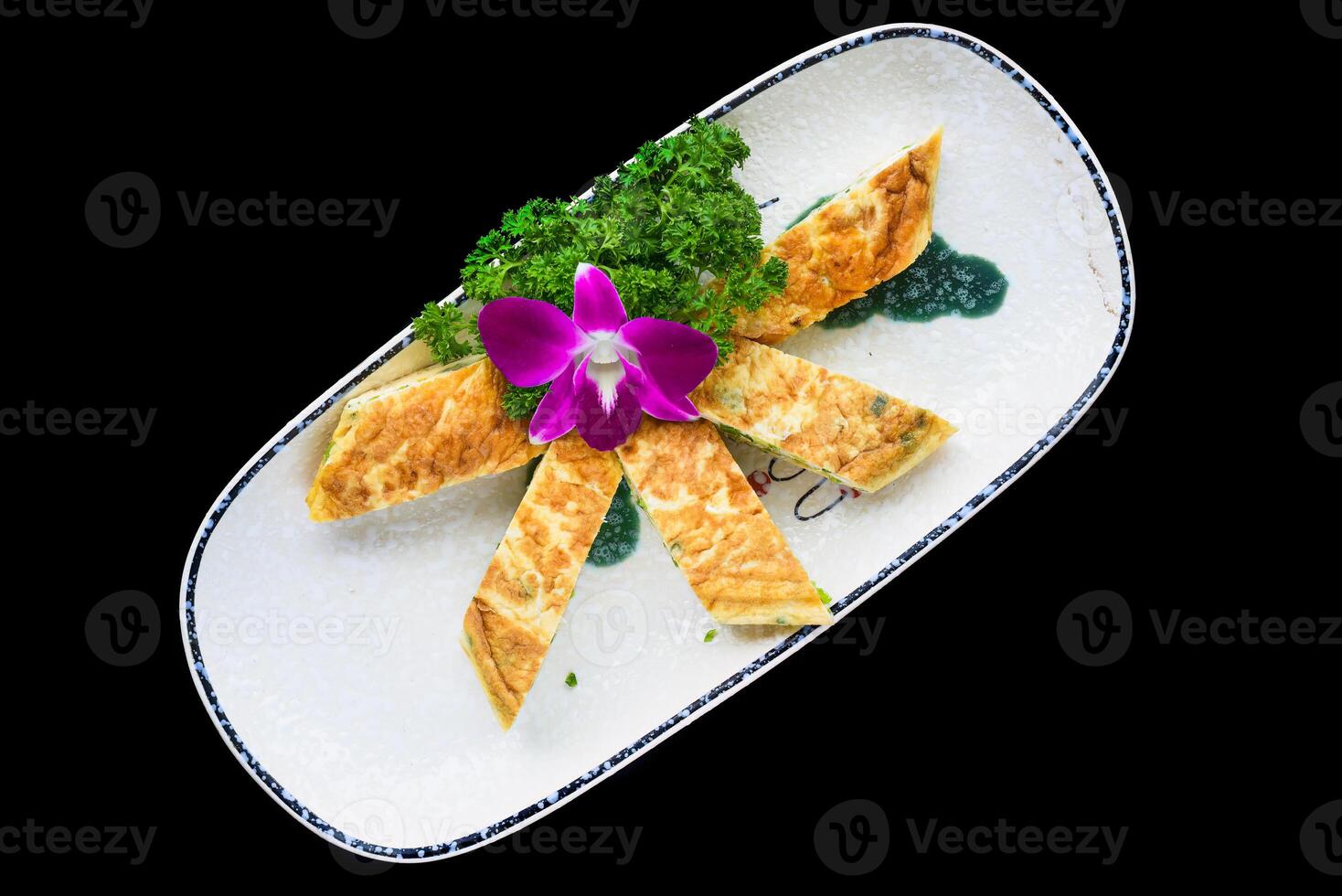 French egg omelette on plate cut on pieces isolated for a menu photo