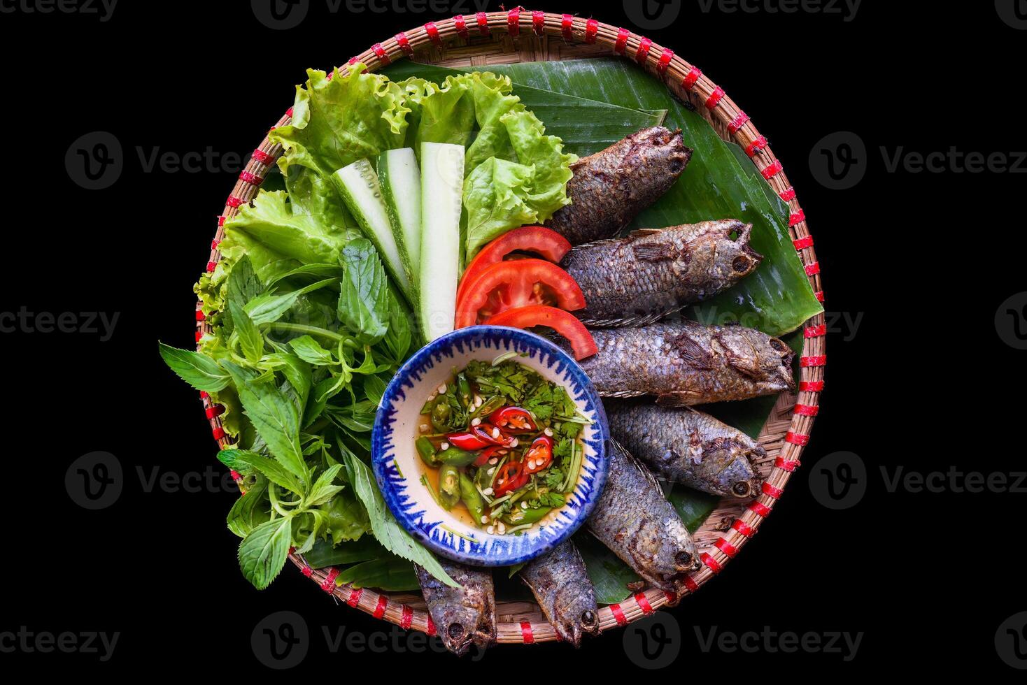Vietnamese Pa pinh top fried fish with vegetables photo