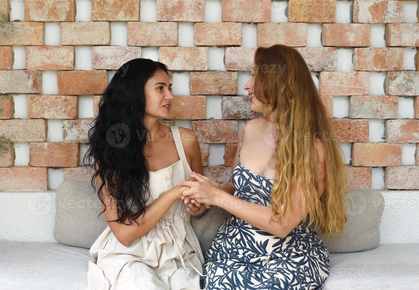 beautiful blonde woman talk with her best friend photo