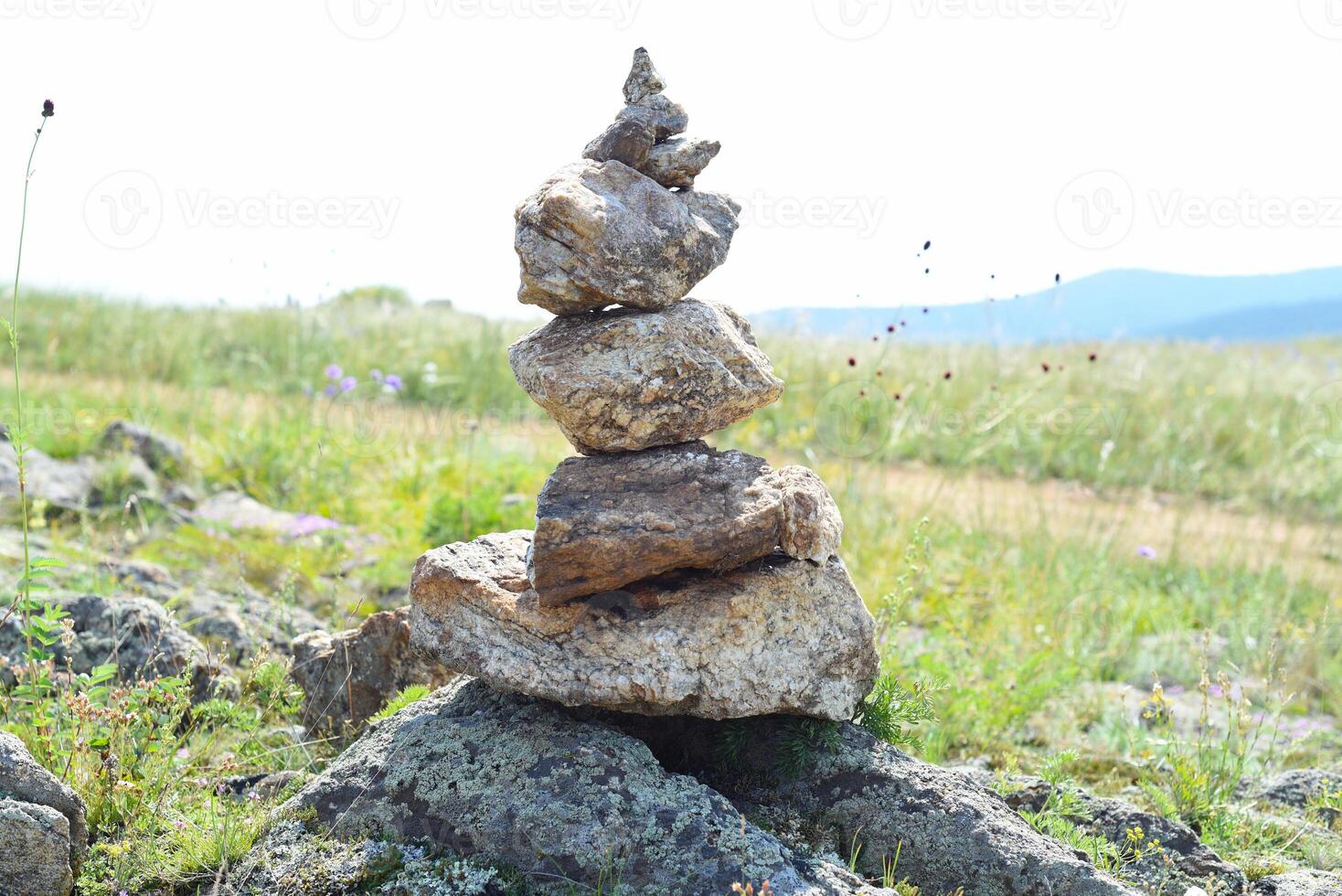 Rock balancing as shamanism religion symbol in Olkhon Russia photo