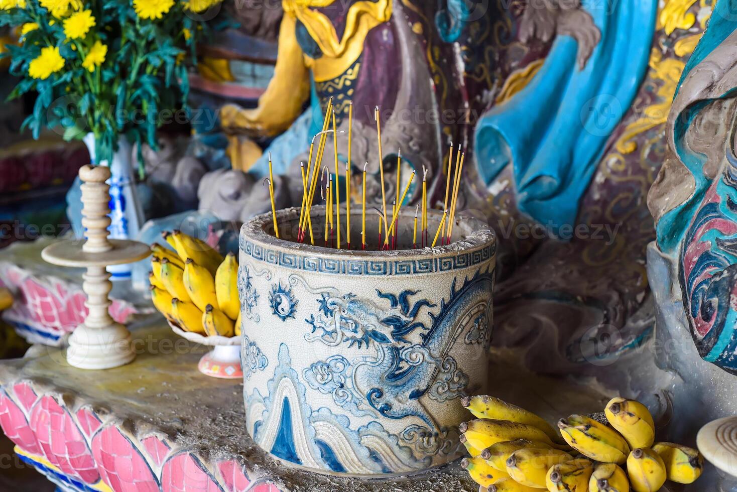 Senko candles smoldering in the Vietnamese Buddhist temple photo