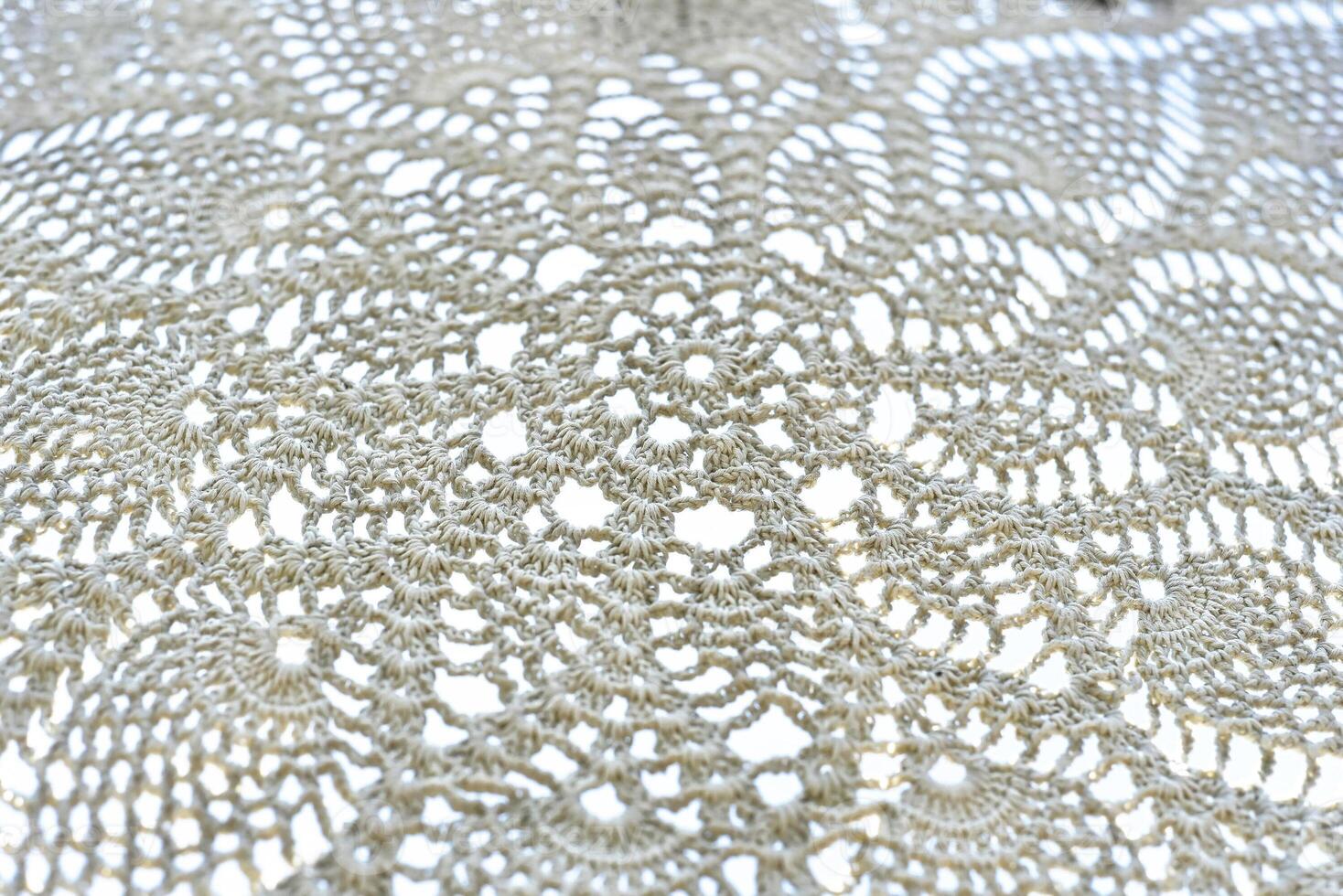 knots of macrame technique made of white threads photo