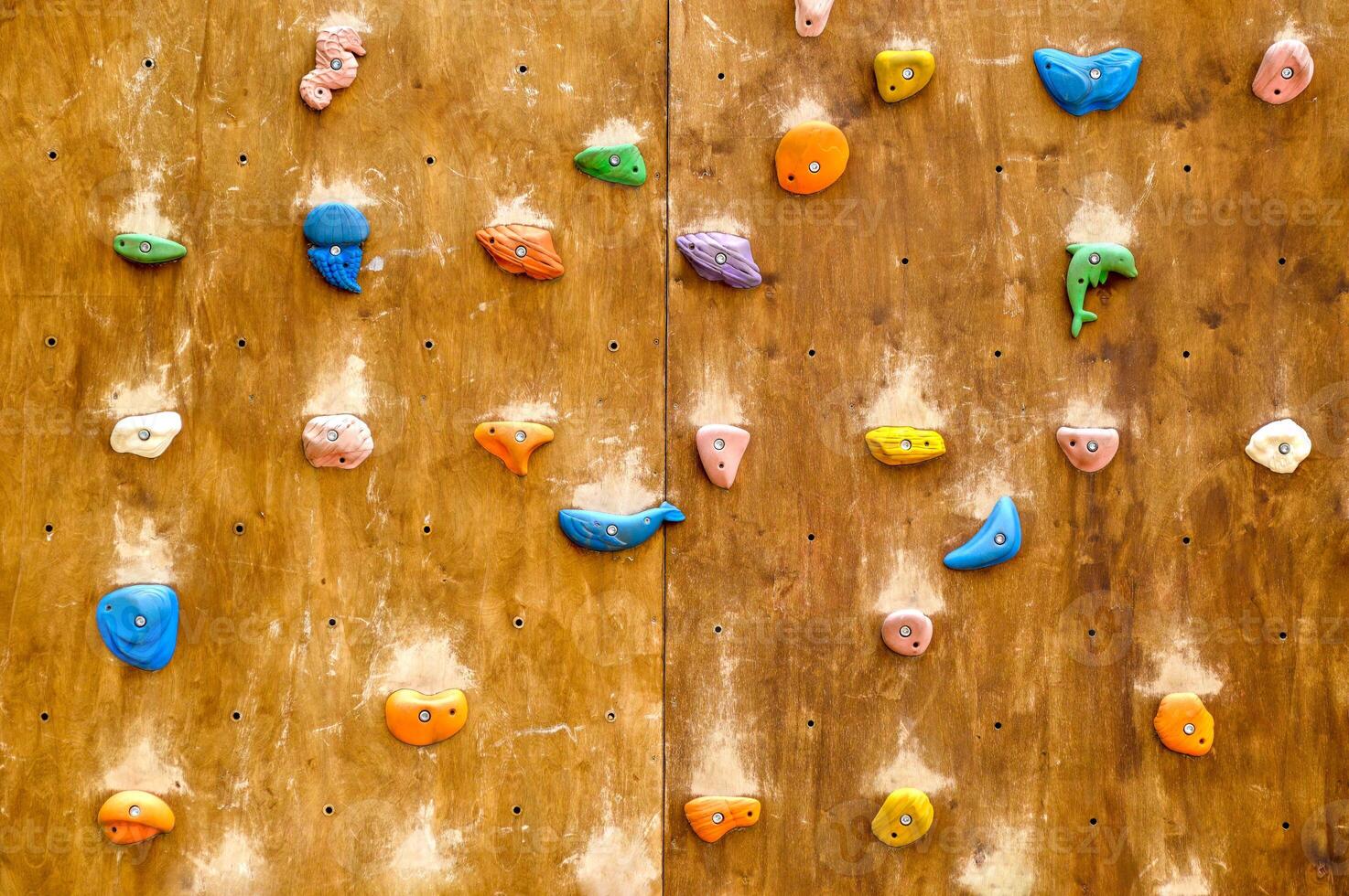Childrens public climbing wall with marine colorful figures in the park photo