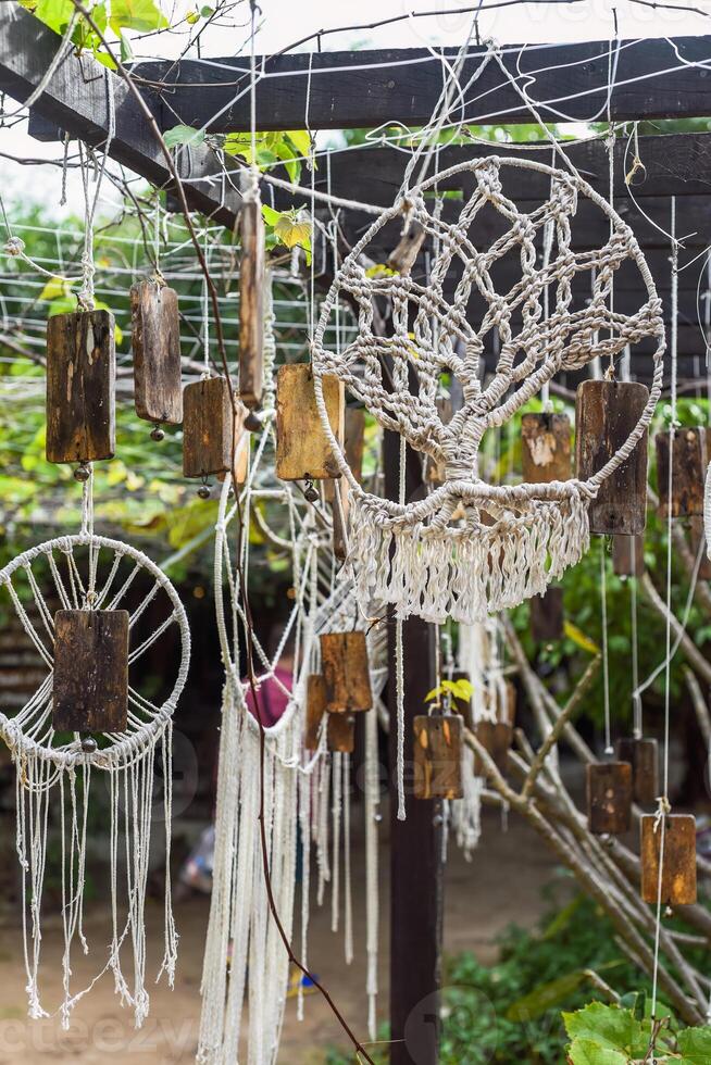Examples of standart tree pattern knots of macrame technique made of white threads photo