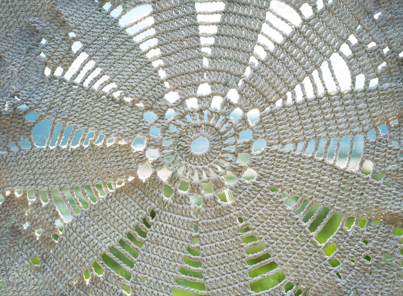 Various knot of macrame technique made of white threads photo