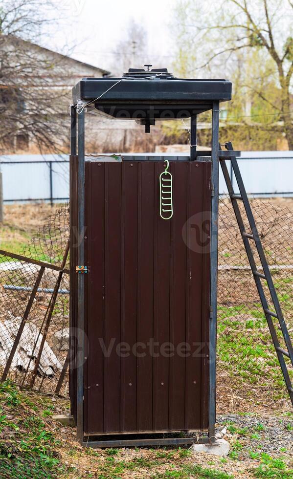 rural homemade outdoor shower for gardening and farming photo