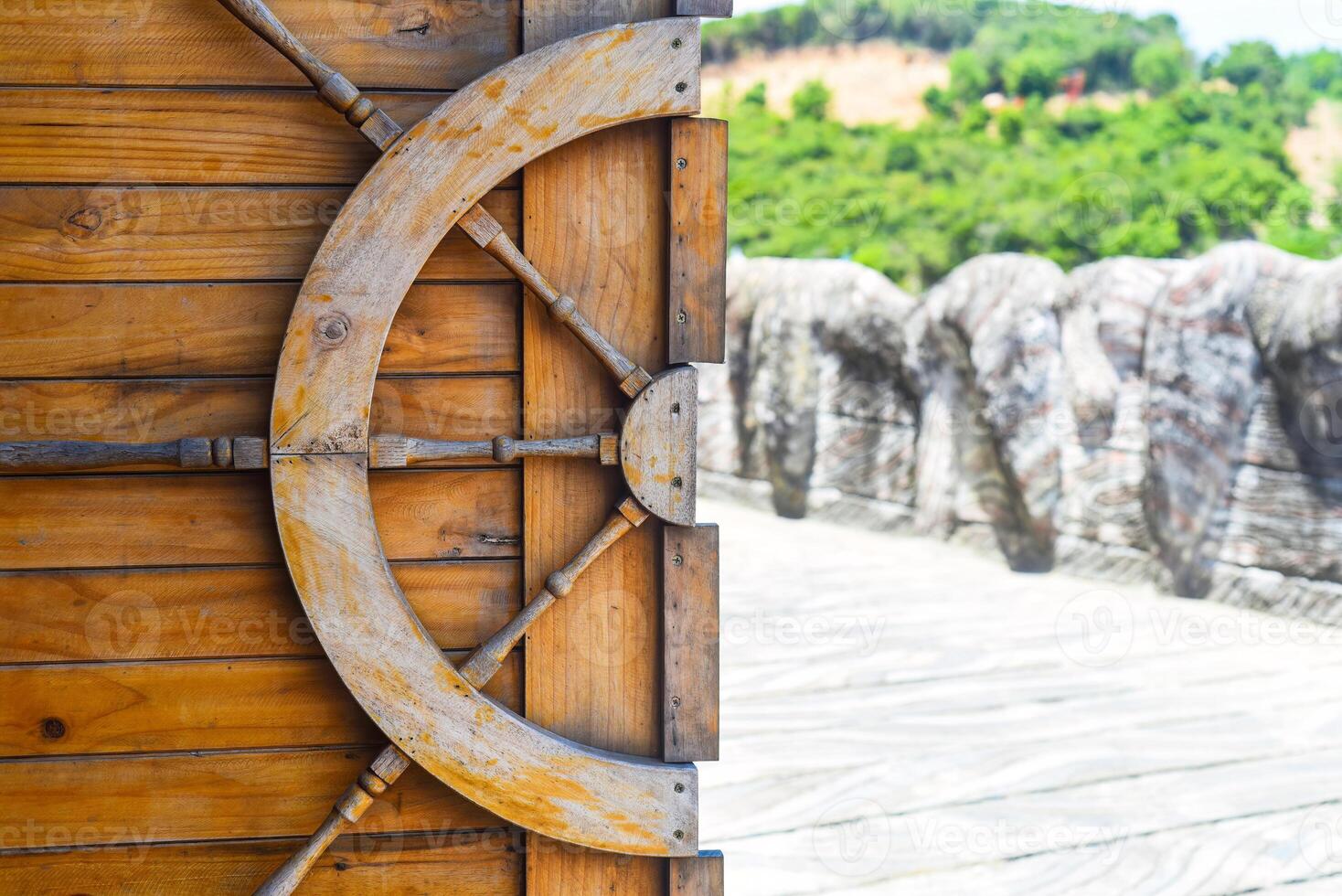 Wooden helm decoration on a gate door photo