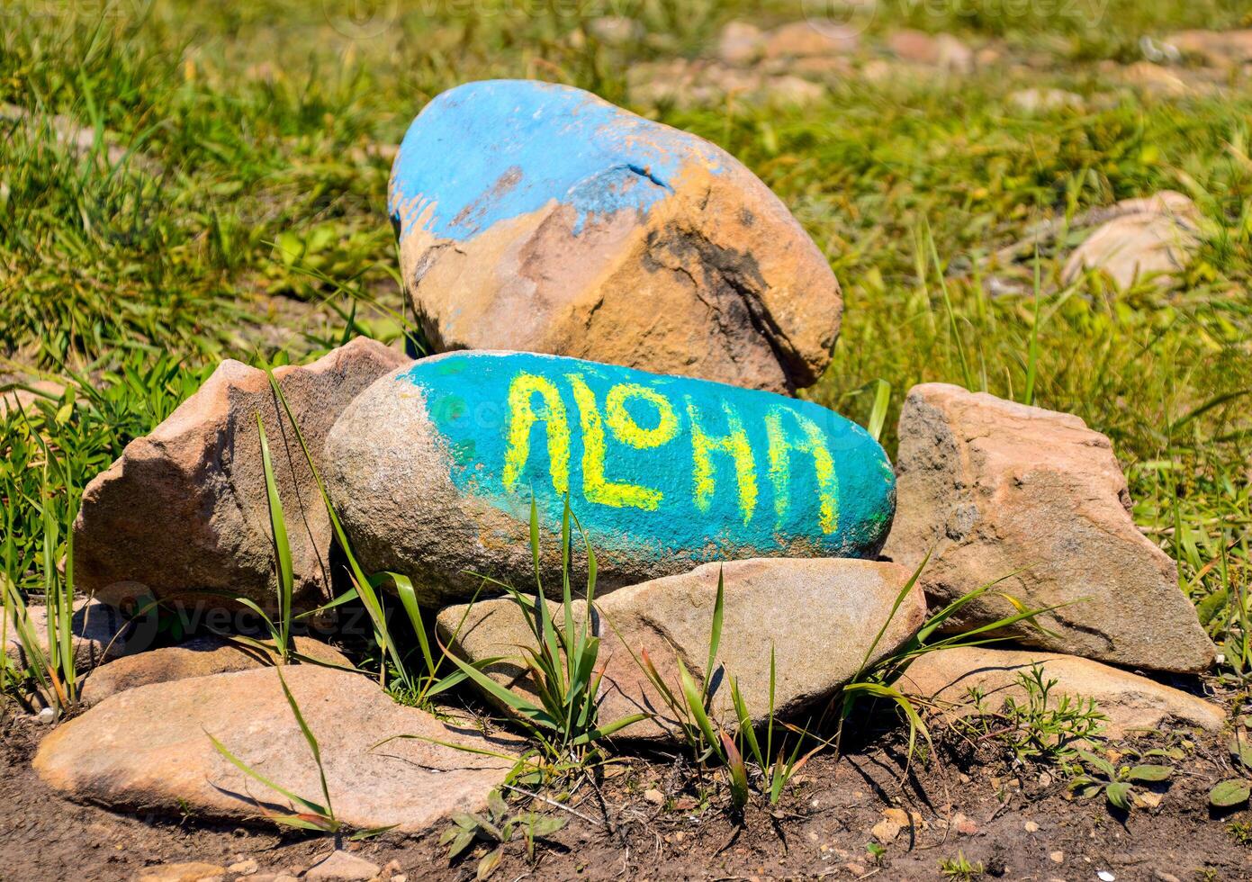 Aloha inscription painted on a pile of stones photo