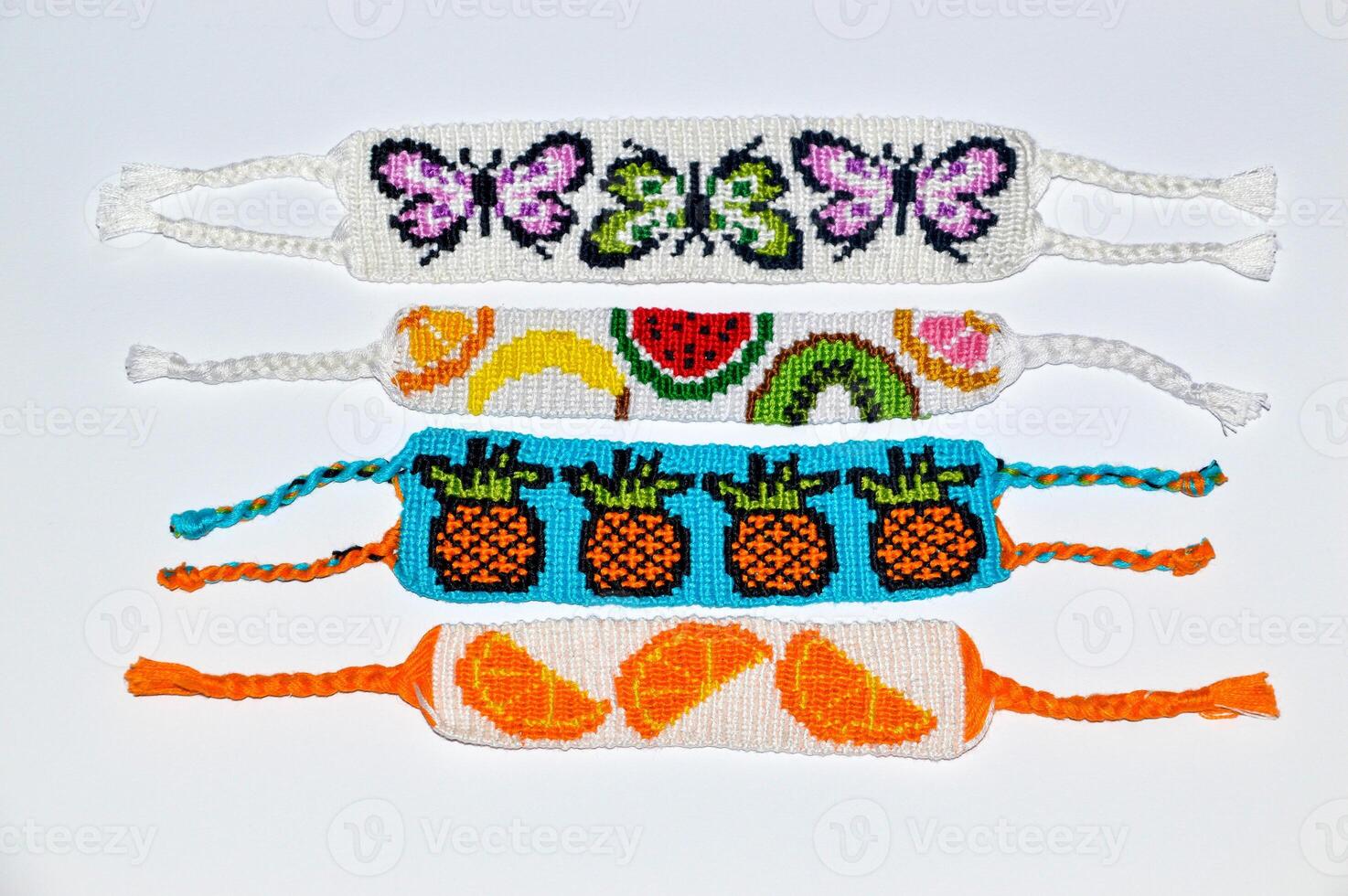 Woven friendship bracelets with alpha and normal patterns handmade of thread photo