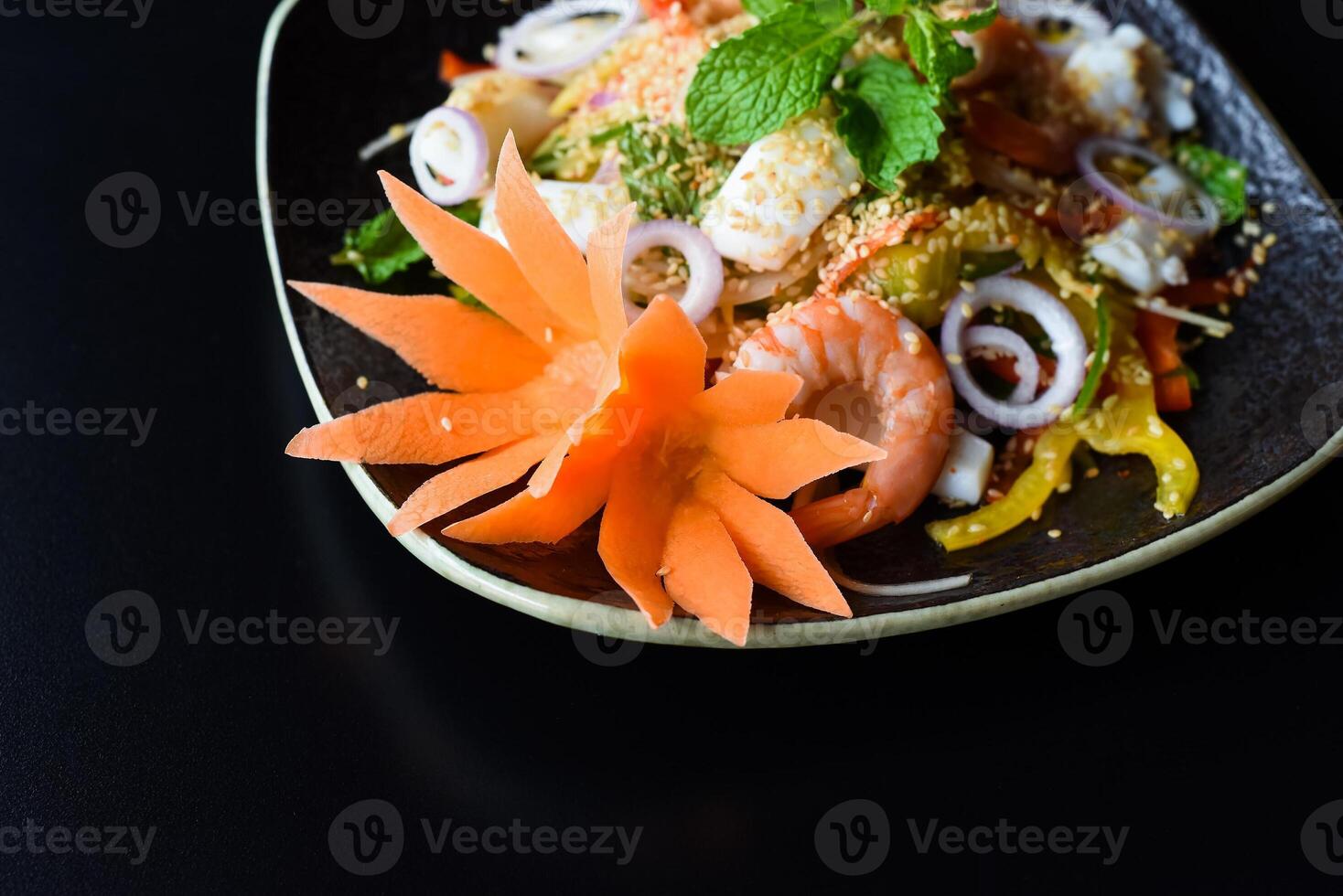 Thai salad made of shrimp and squid and onions isolated photo