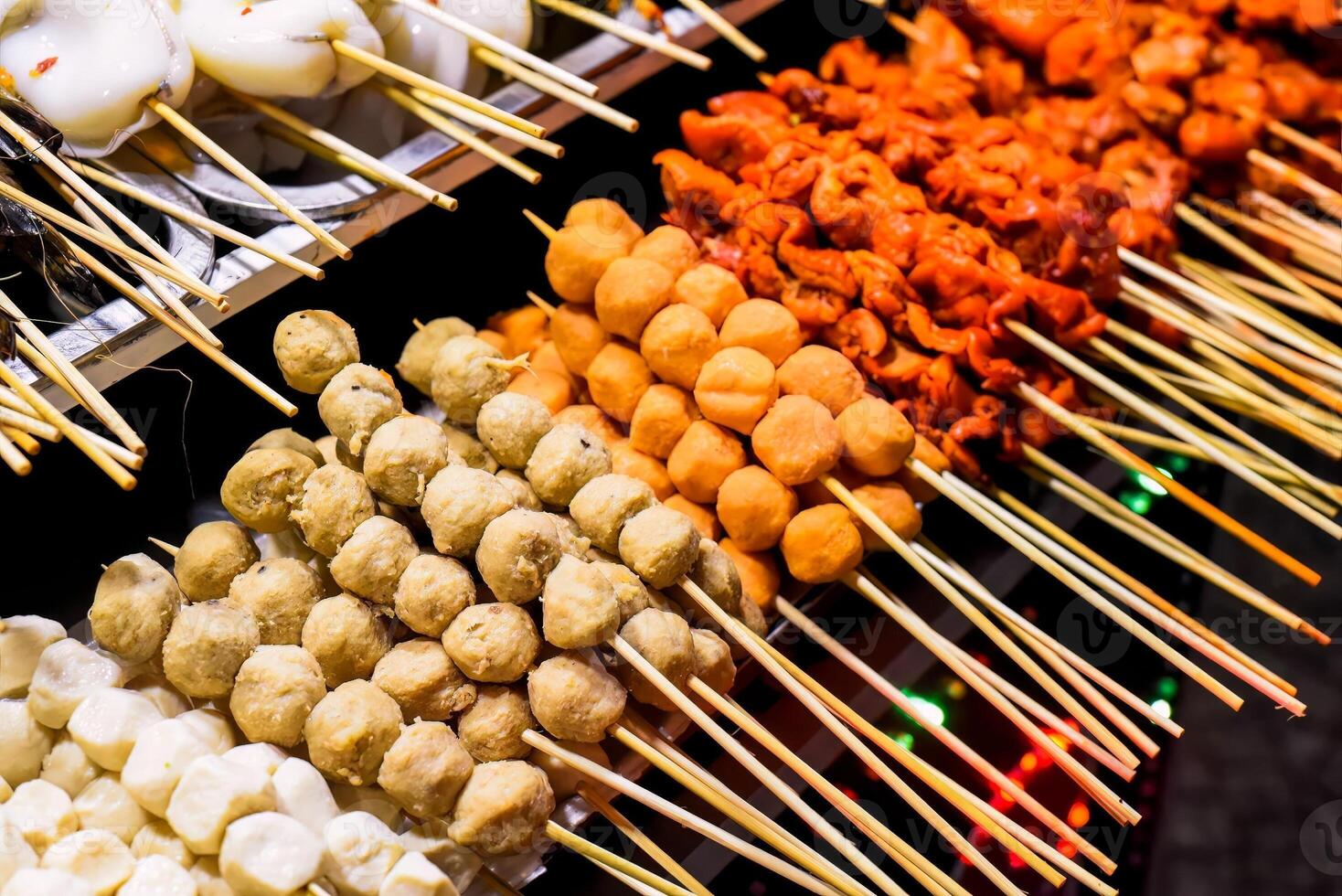Many snacks and seafood in vietnamese night market in Da Lat photo