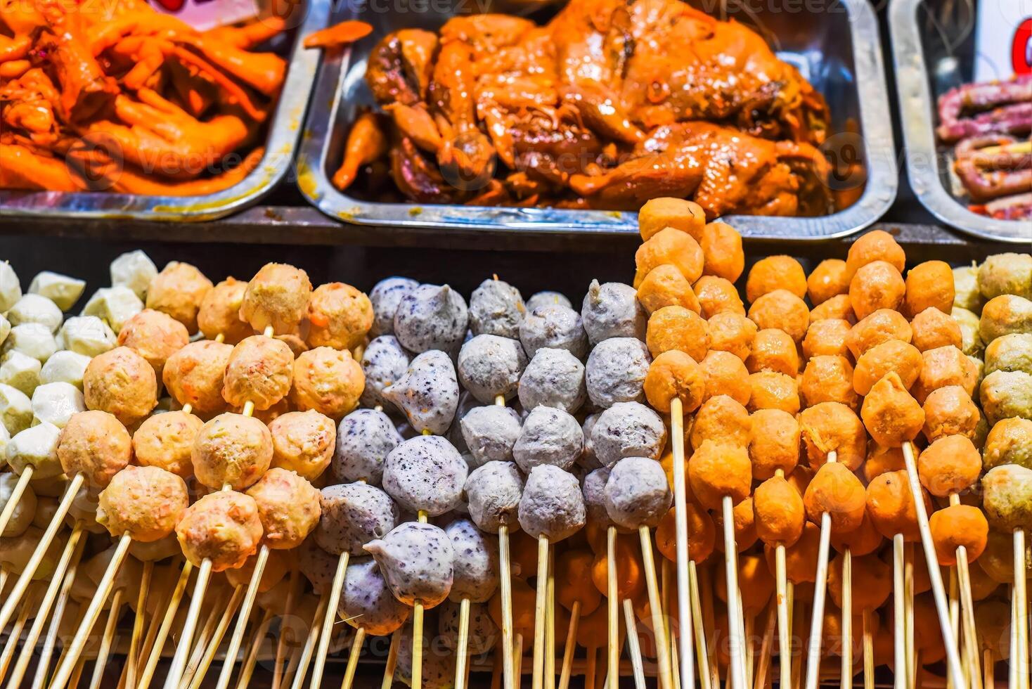 Many snacks and seafood in the vietnamese night market in Da Lat photo