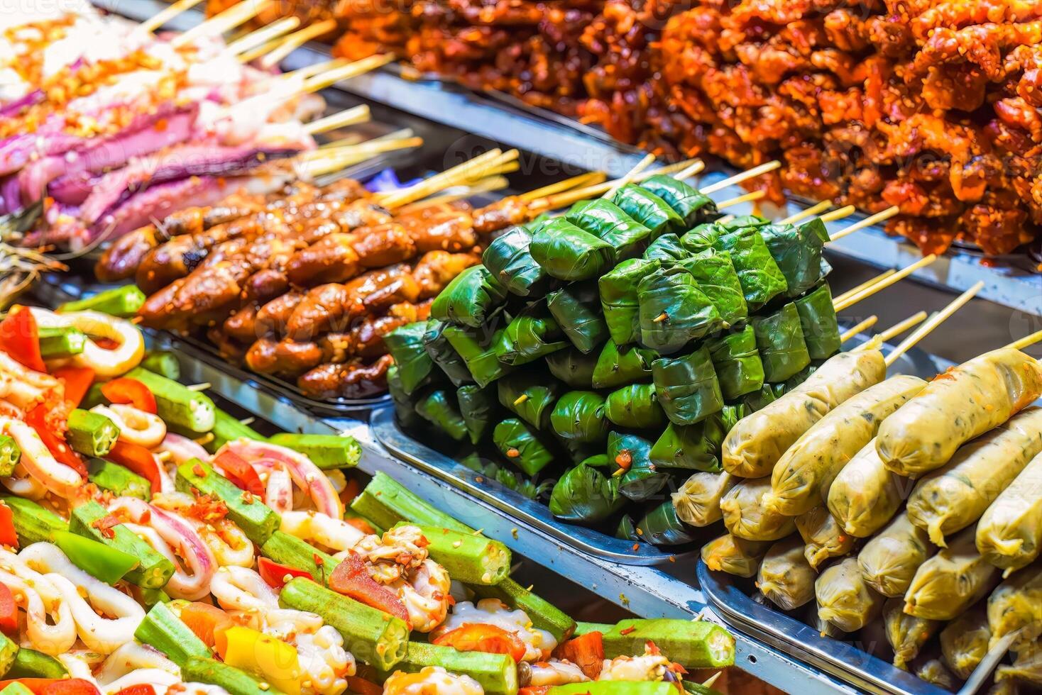 Many snacks and seafood in the vietnamese night market photo