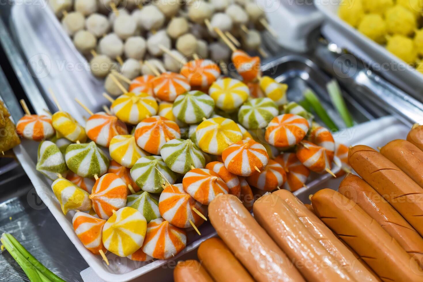 Many snacks and sea food in vietnamese night market in food festival photo