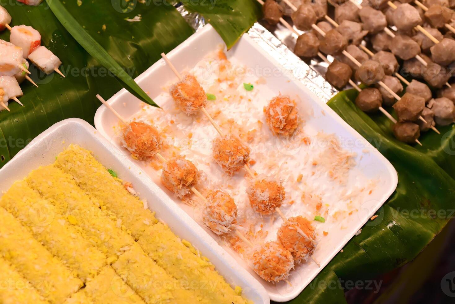 snack and seafood in vietnamese night market in food festival photo