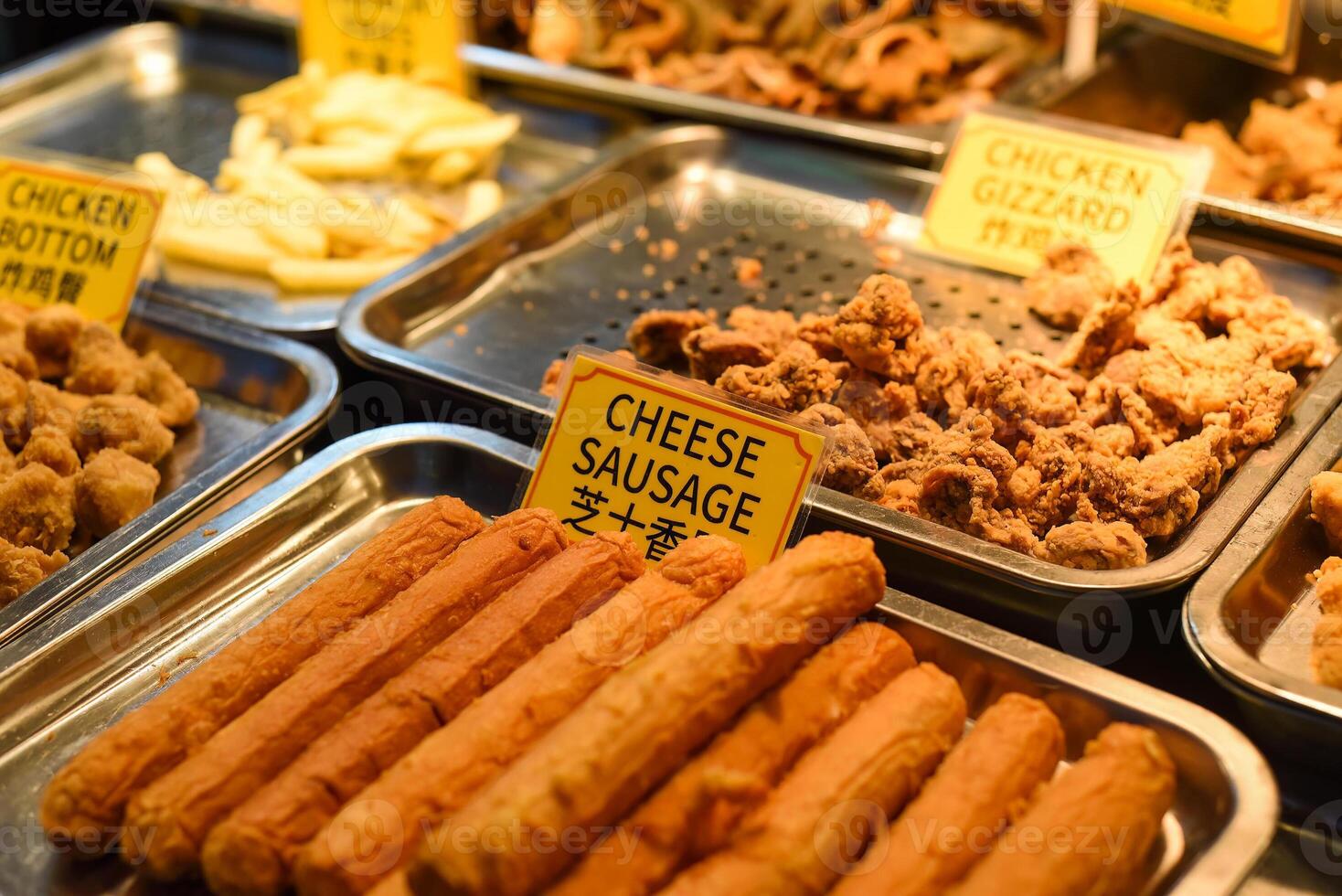 Fried cheese sausages in the street food Jalan Alor in Kuala Lumpur photo