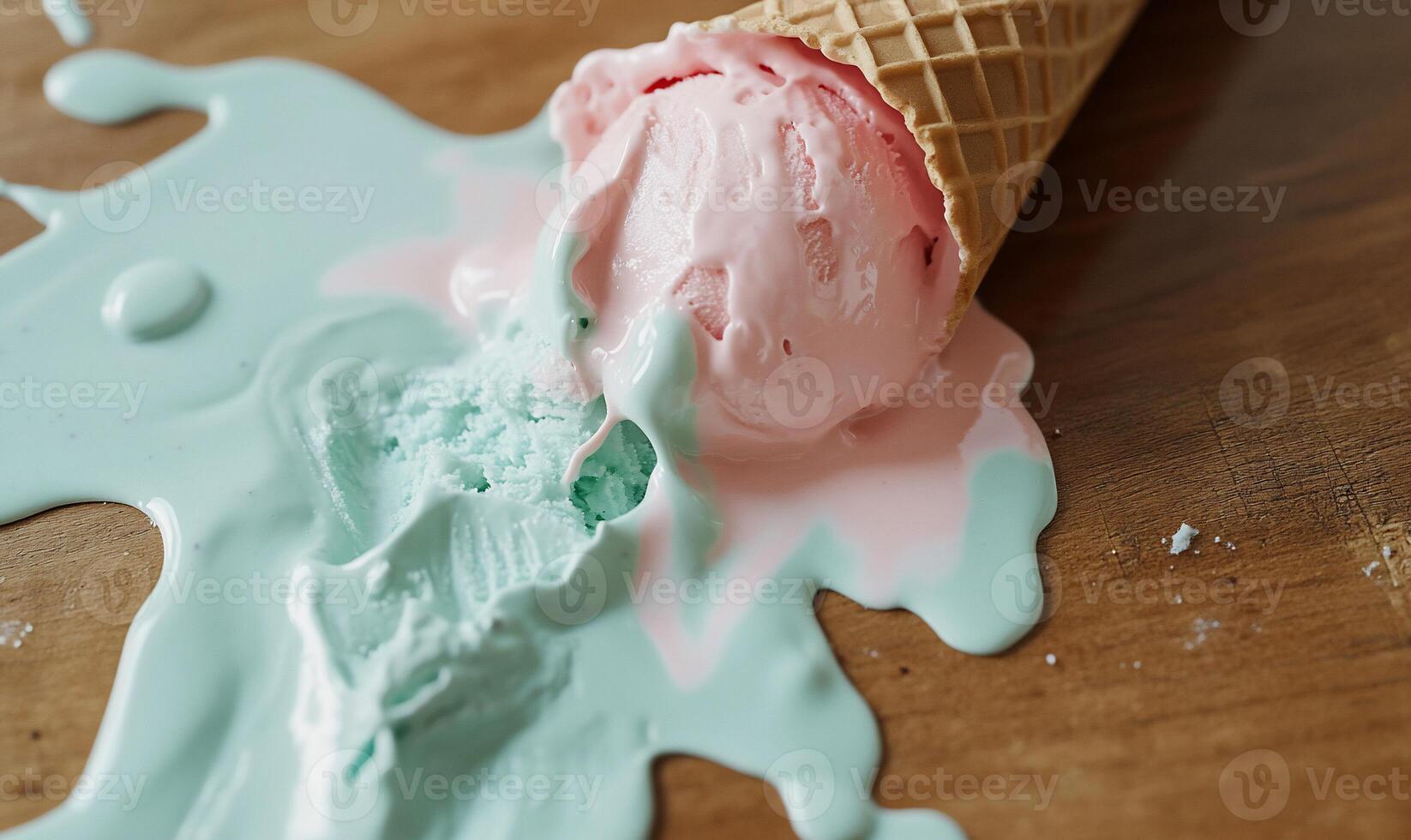 Melted ice cream cone spills on wooden table photo